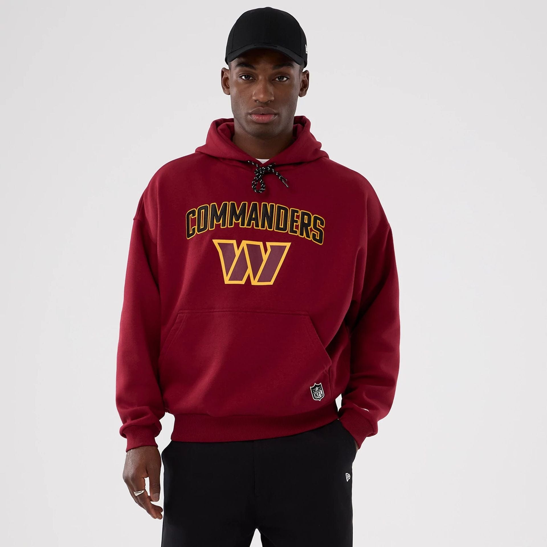 The Male model is wearing Washington Commanders NFL International Series Games 2025 Dark Red Premium Pullover Hoodie 1