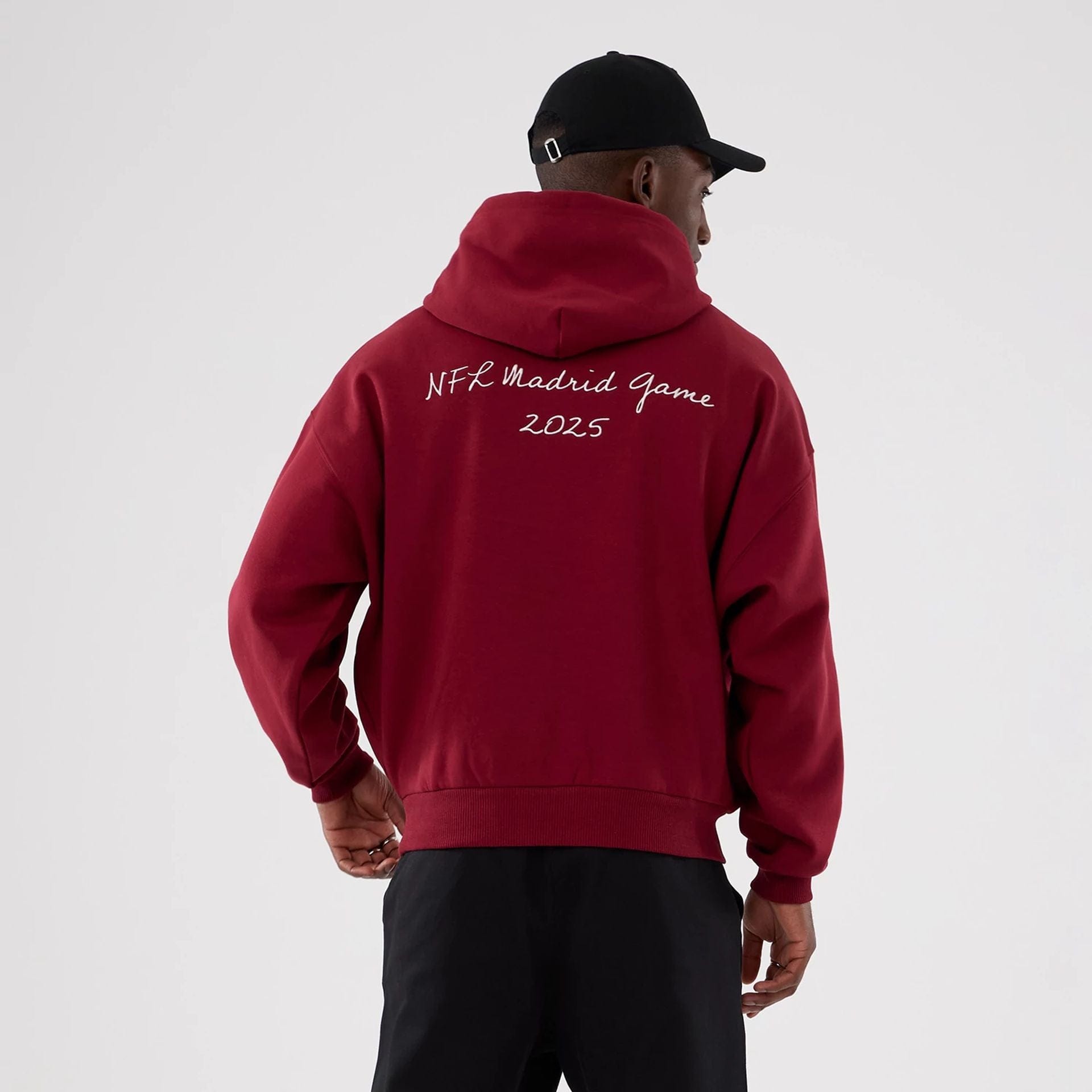 The Male model is wearing Washington Commanders NFL International Series Games 2025 Dark Red Premium Pullover Hoodie 2