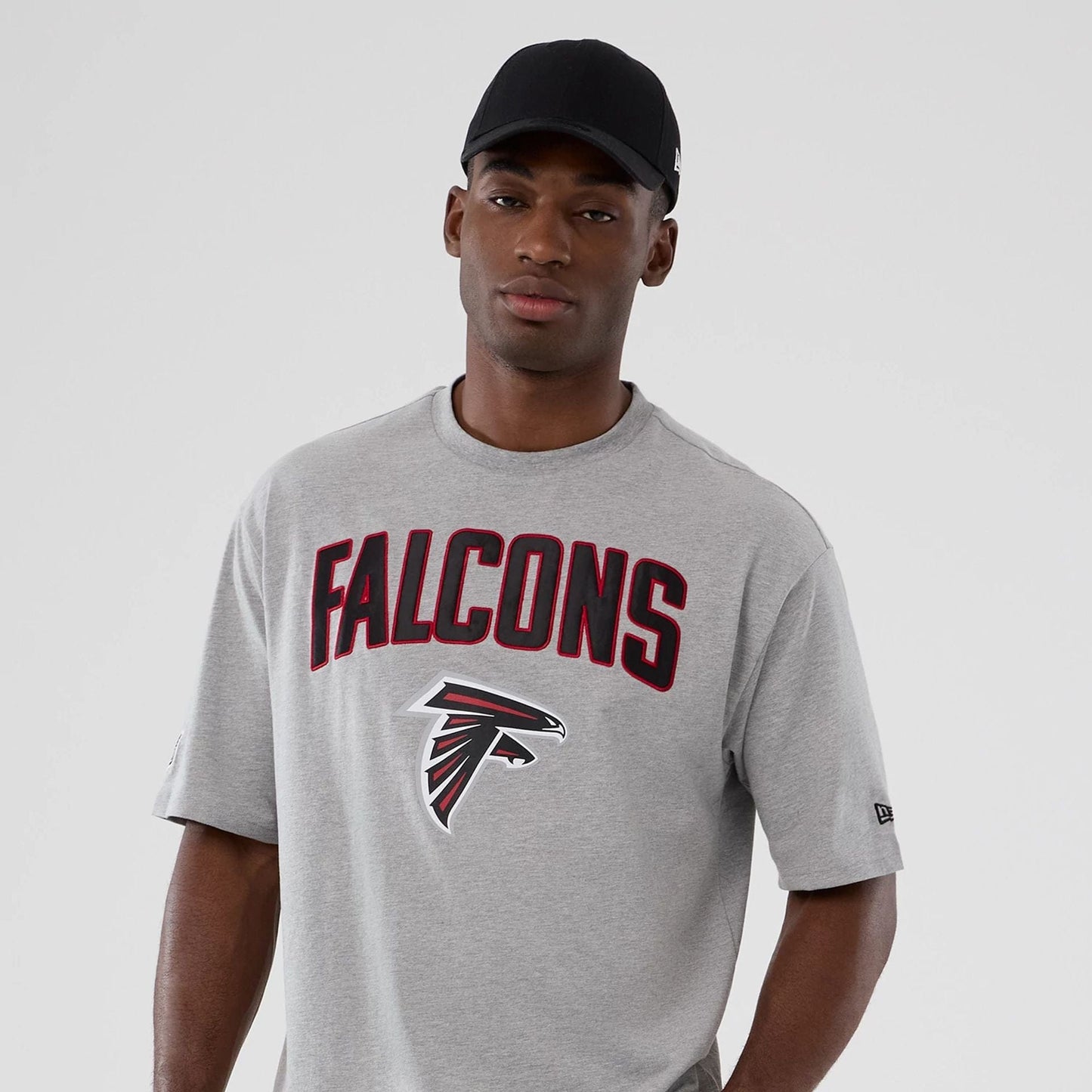 The Male model is wearing Atlanta Falcons NFL International Series Games 2025 Grey Premium T-Shirt 7