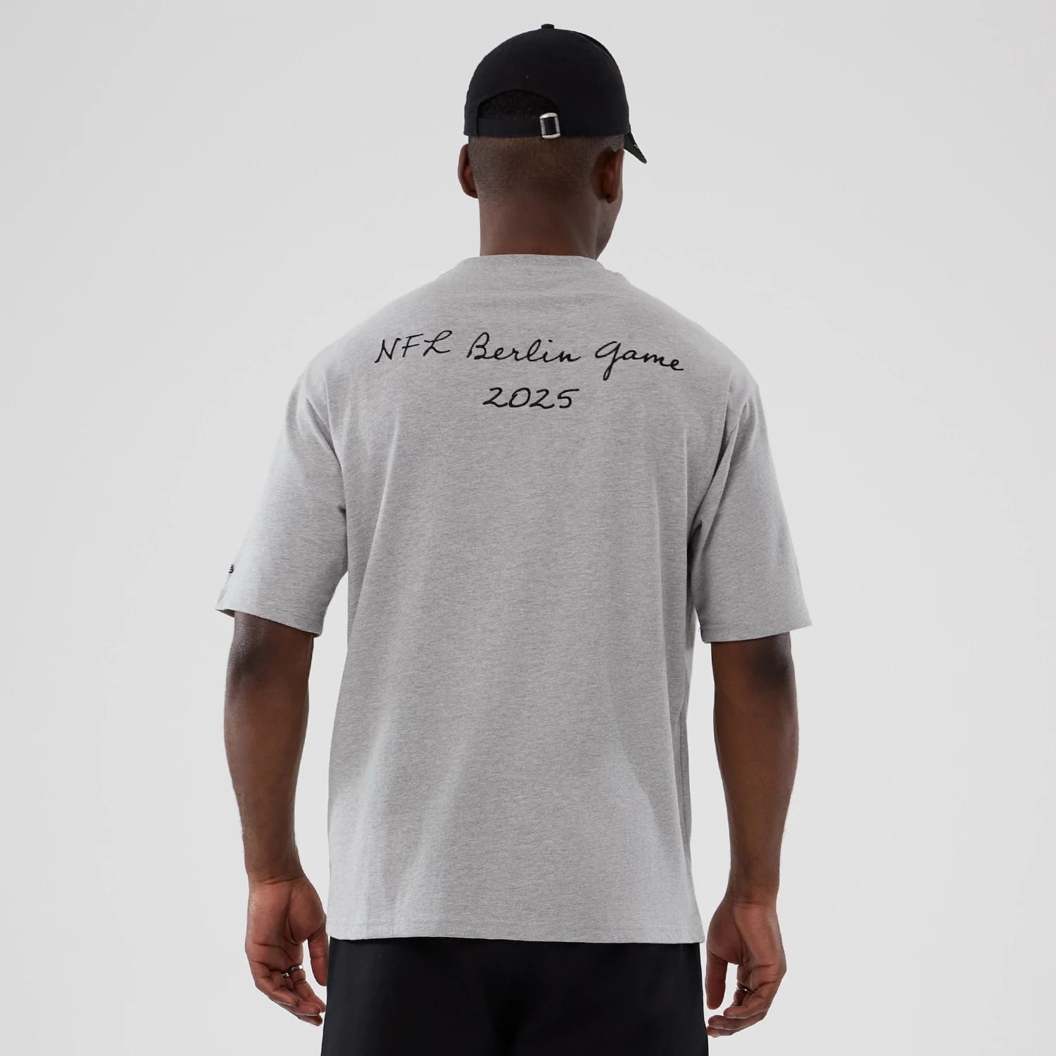 The Male model is wearing Atlanta Falcons NFL International Series Games 2025 Grey Premium T-Shirt 2