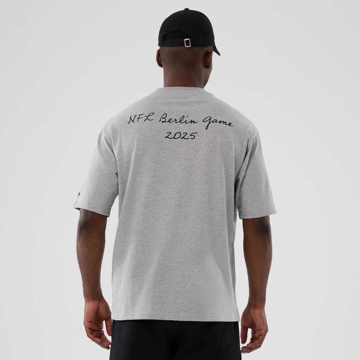 The Male model is wearing Atlanta Falcons NFL International Series Games 2025 Grey Premium T-Shirt 2