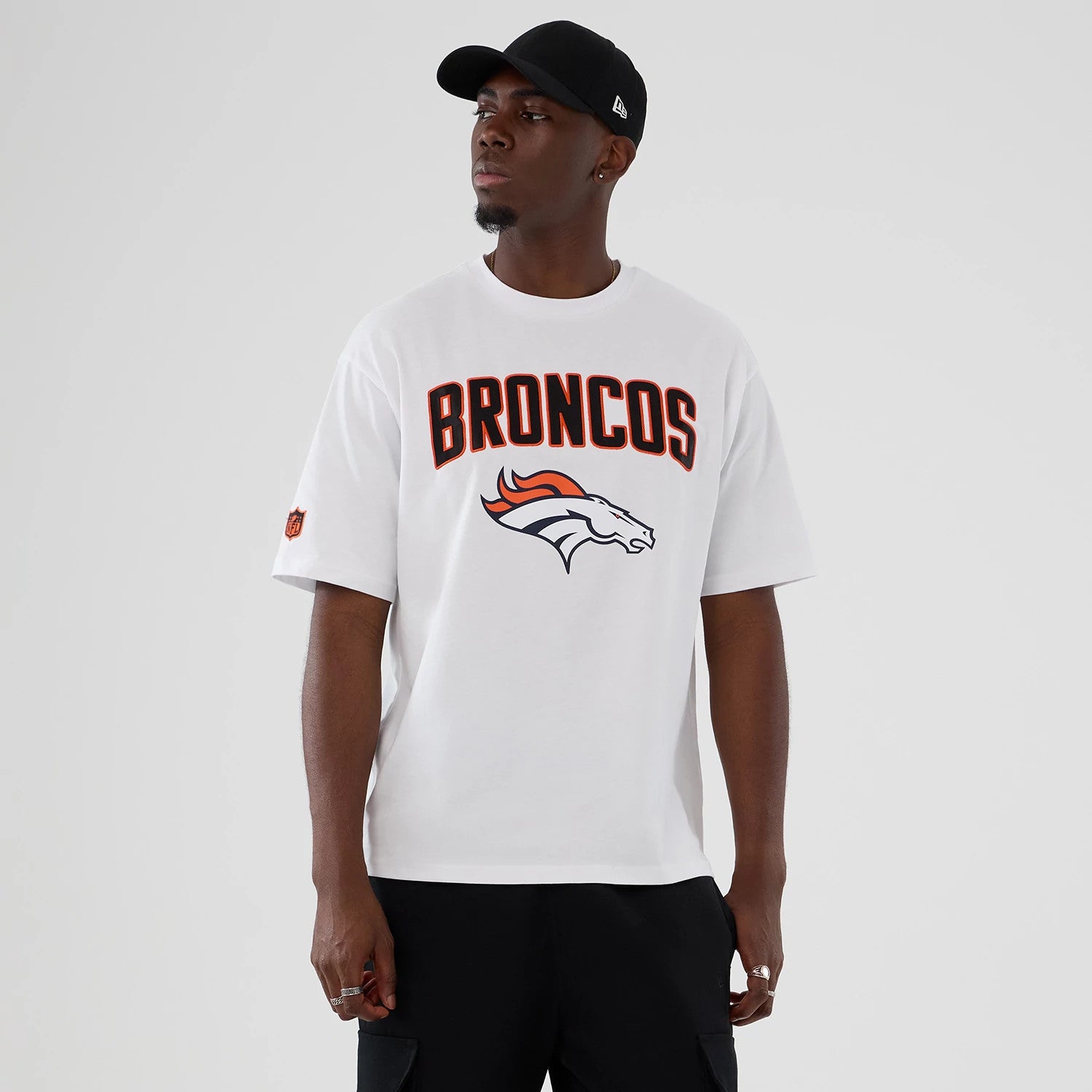 The Male model is wearing Denver Broncos NFL International Series Games 2025 White Premium T-Shirt 1