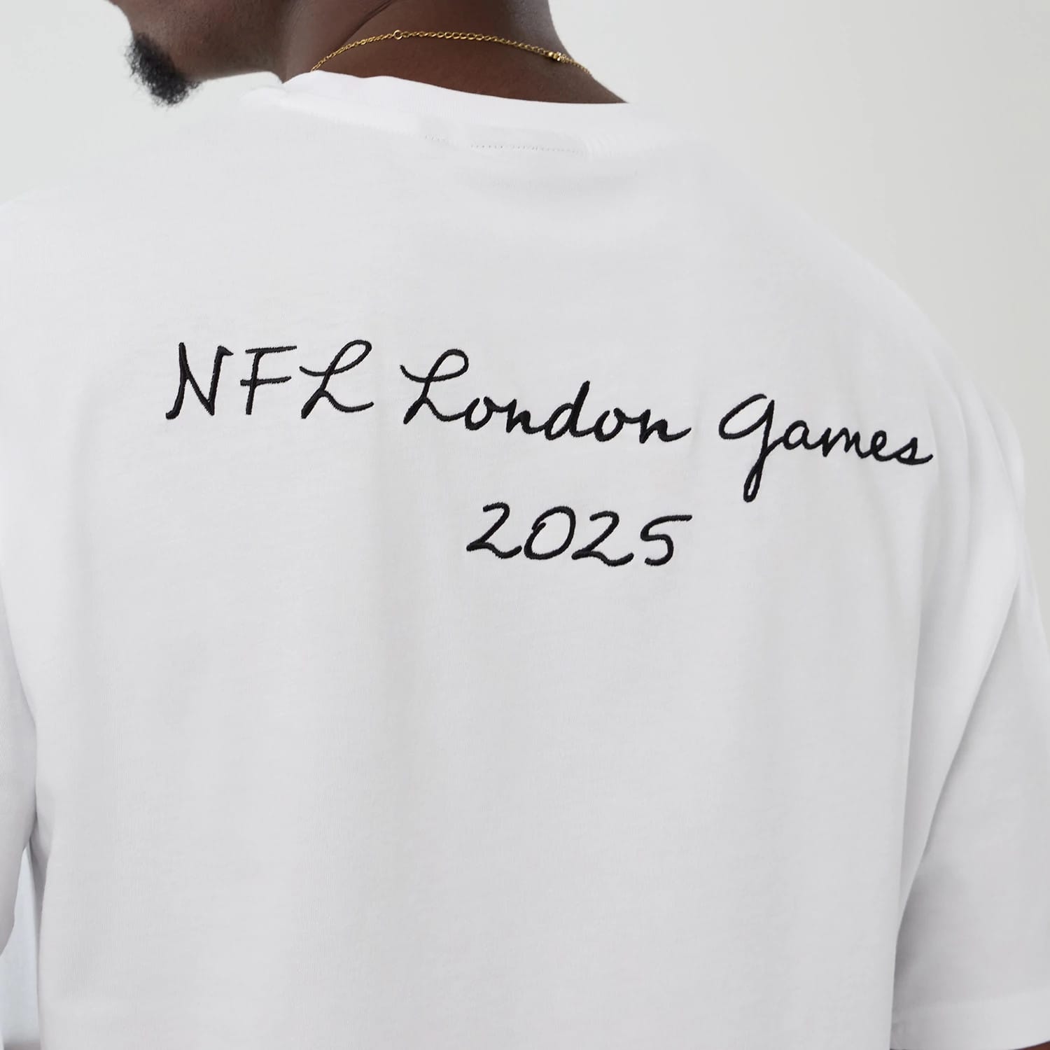 The Male model is wearing Denver Broncos NFL International Series Games 2025 White Premium T-Shirt 4