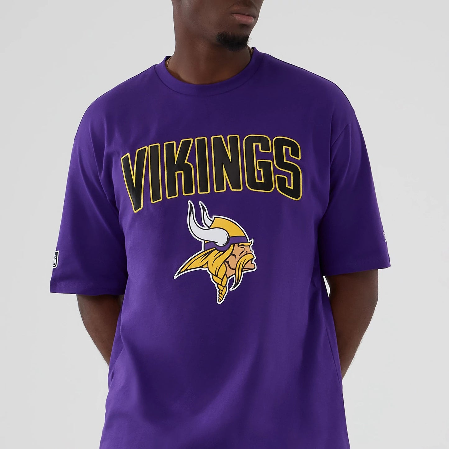 The Male model is wearing Minnesota Vikings NFL International Series Games 2025 Purple Premium T-Shirt 7