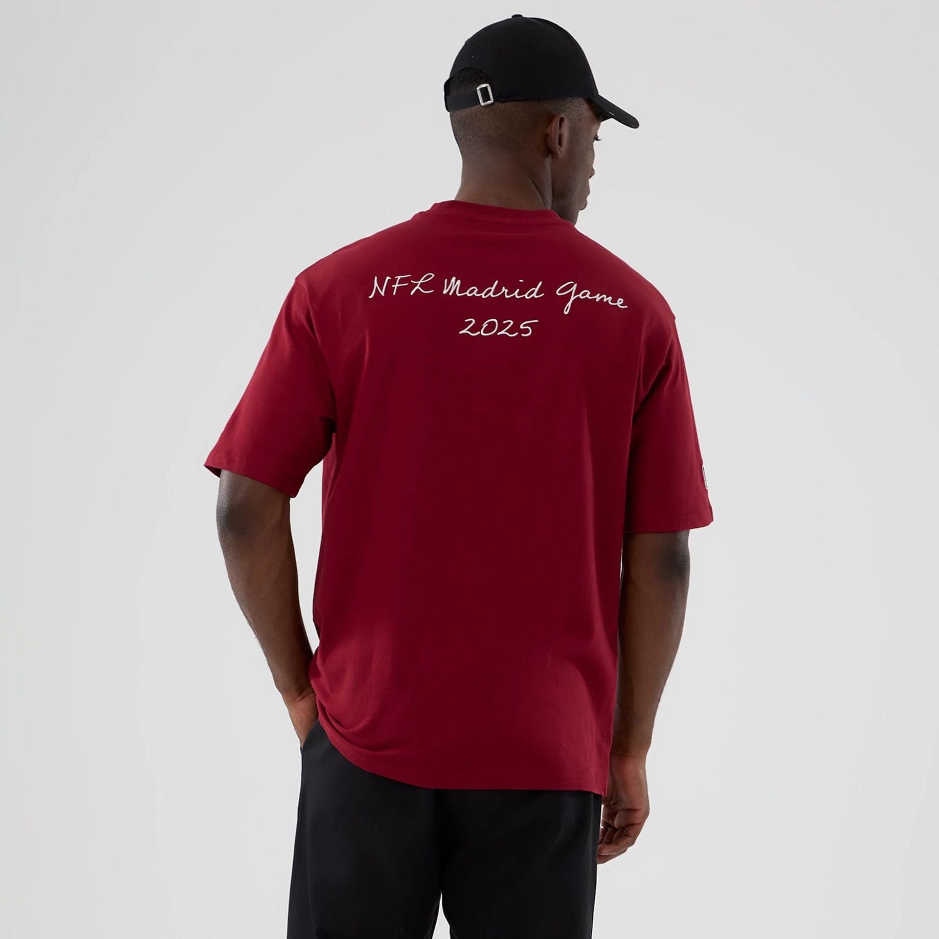 The Male model is wearing Washington Commanders NFL International Series Games 2025 Dark Red Premium T-Shirt 2