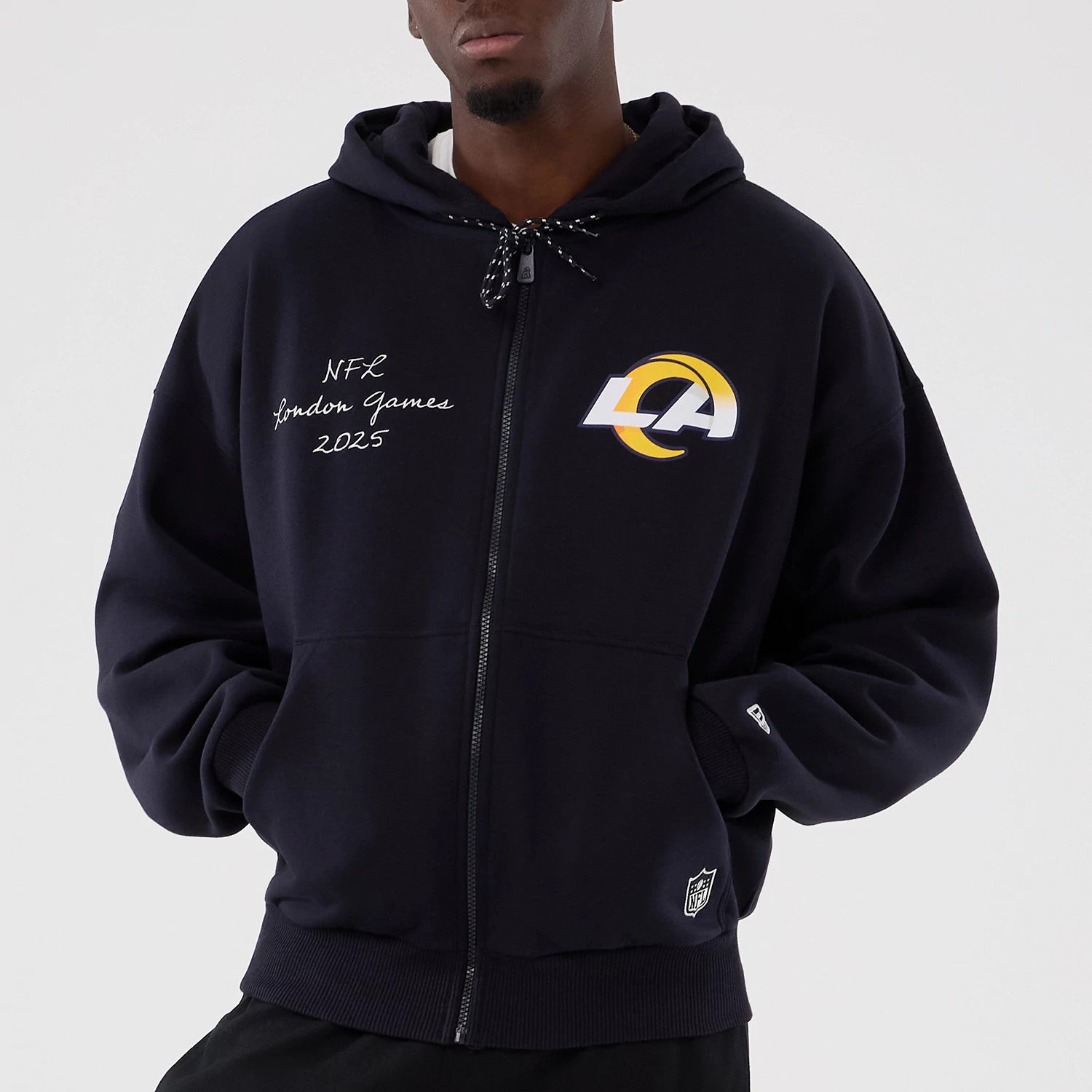 The Male model is wearing LA Rams NFL International Series Games 2025 Navy Premium Pullover Hoodie 3