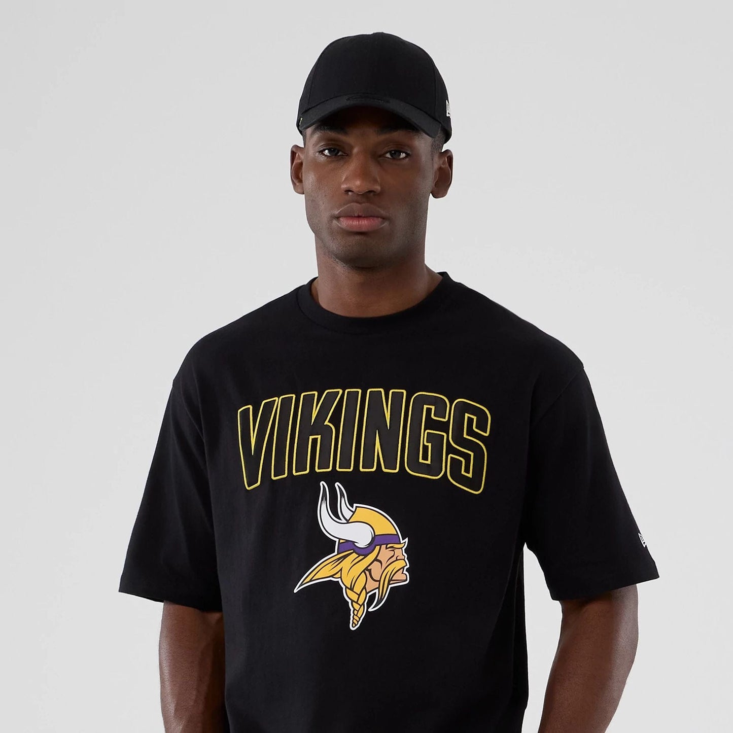 The Male model is wearing Minnesota Vikings NFL International Series Games 2025 Black Premium T-Shirt 7