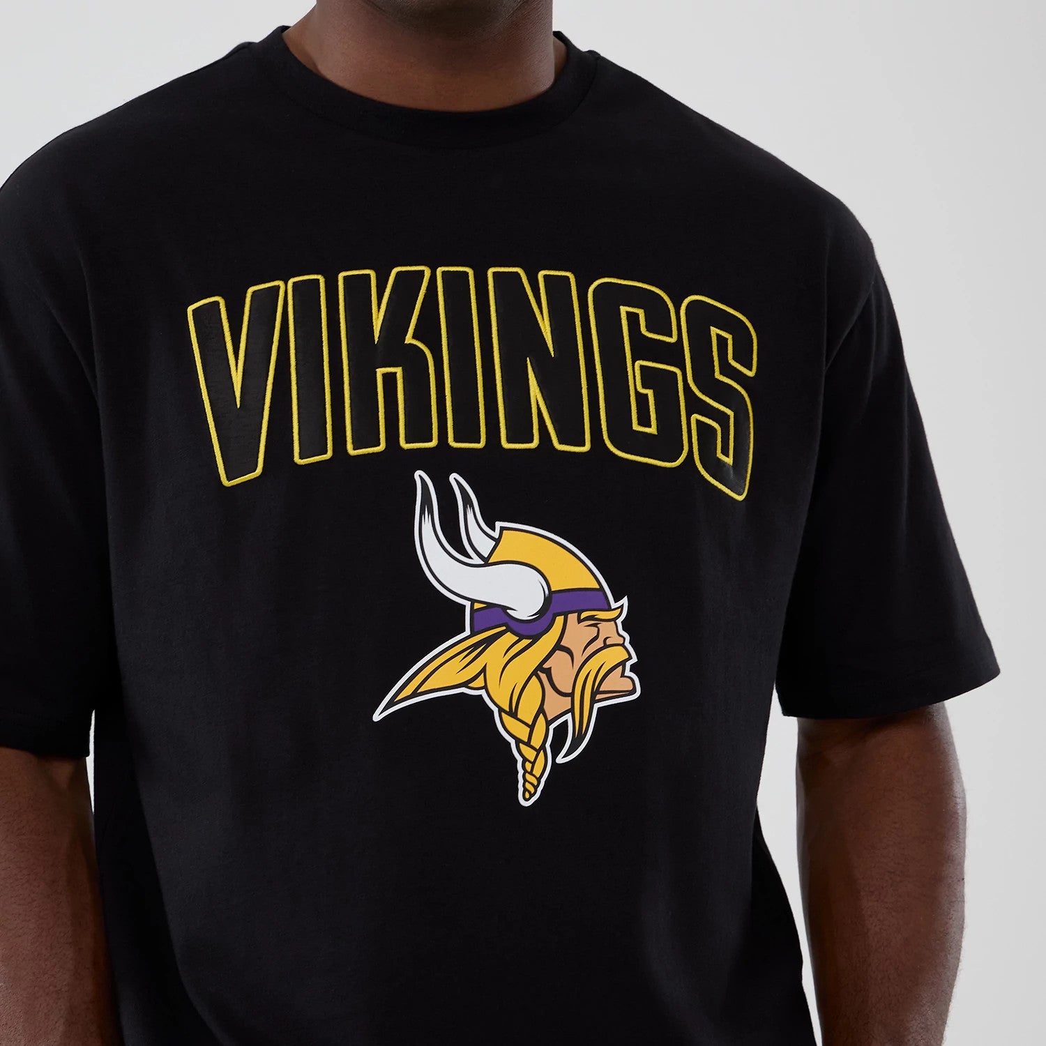 The Male model is wearing Minnesota Vikings NFL International Series Games 2025 Black Premium T-Shirt 3