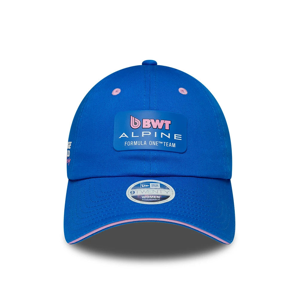 Alpine Racing Womens Team Blue Pony Tail New Era Cap, front view showing the BWT Alpine Formula One Team logo embroidered on the structured blue crown, with pink eyelets and a grey 9TWENTY size sticker on the curved visor.