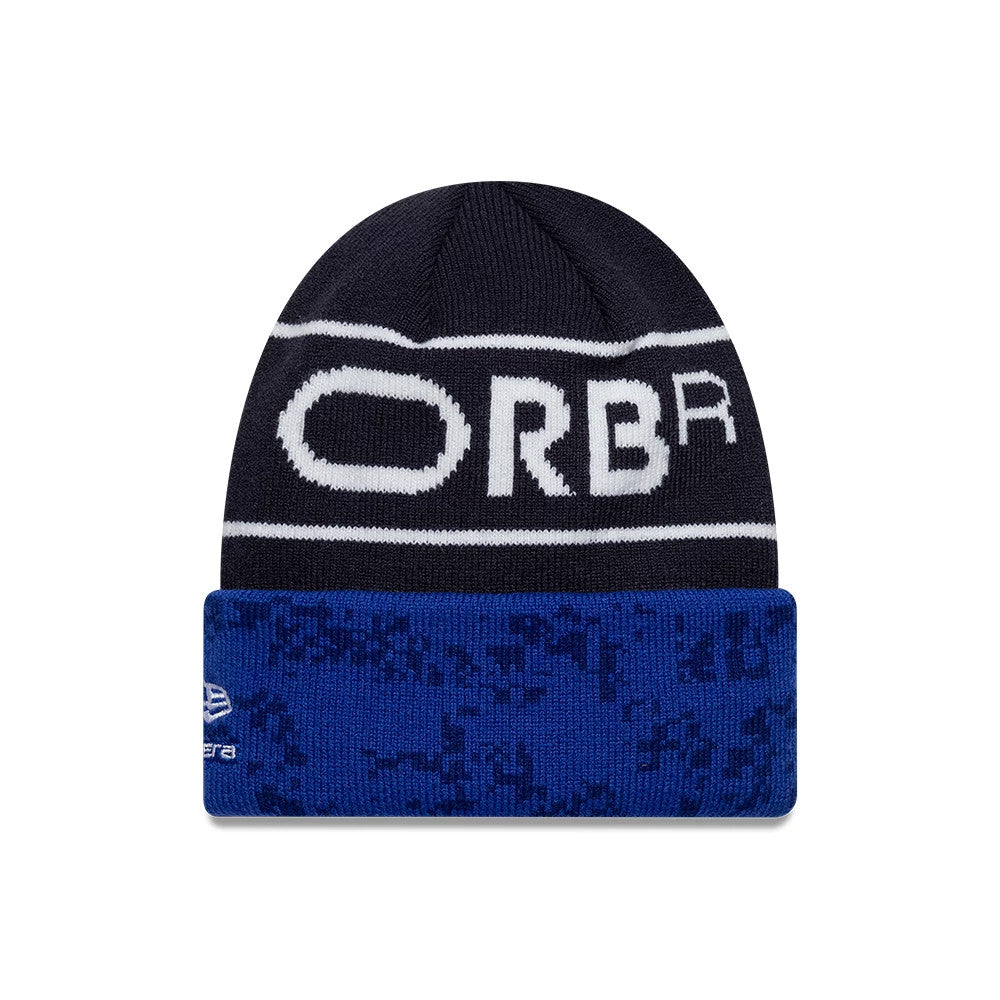 New Era Red Bull Racing Youth Team Dark Blue Cuff Knit Beanie Hat, front view showing white ORBR lettering on a dark blue band, New Era logo on the left side of the folded blue cuff with a digital pattern.