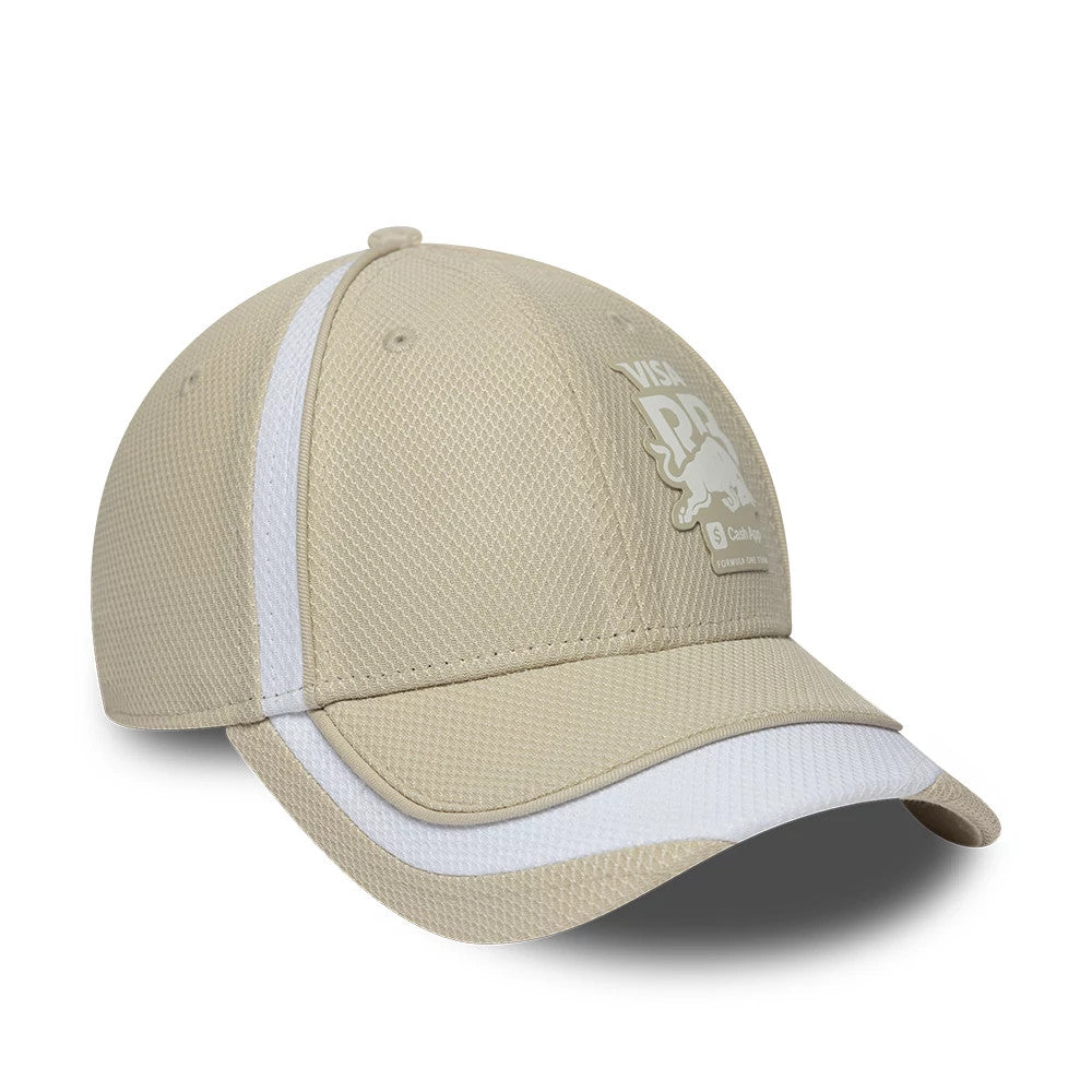 Visa Cash App Racing Bulls F1 Race Special Beige New Era 9FORTY Adjustable Cap, three-quarter view showing the white raised embroidery logo on the front panel, and a contrasting white stripe along the curved beige visor.