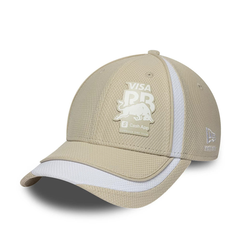 Visa Cash App Racing Bulls F1 Race Special Beige New Era 9FORTY Adjustable Cap, three-quarter view showing the white logo patch on the front panel, matching white stripe along one side, and New Era flag logo embroidered on the left side.