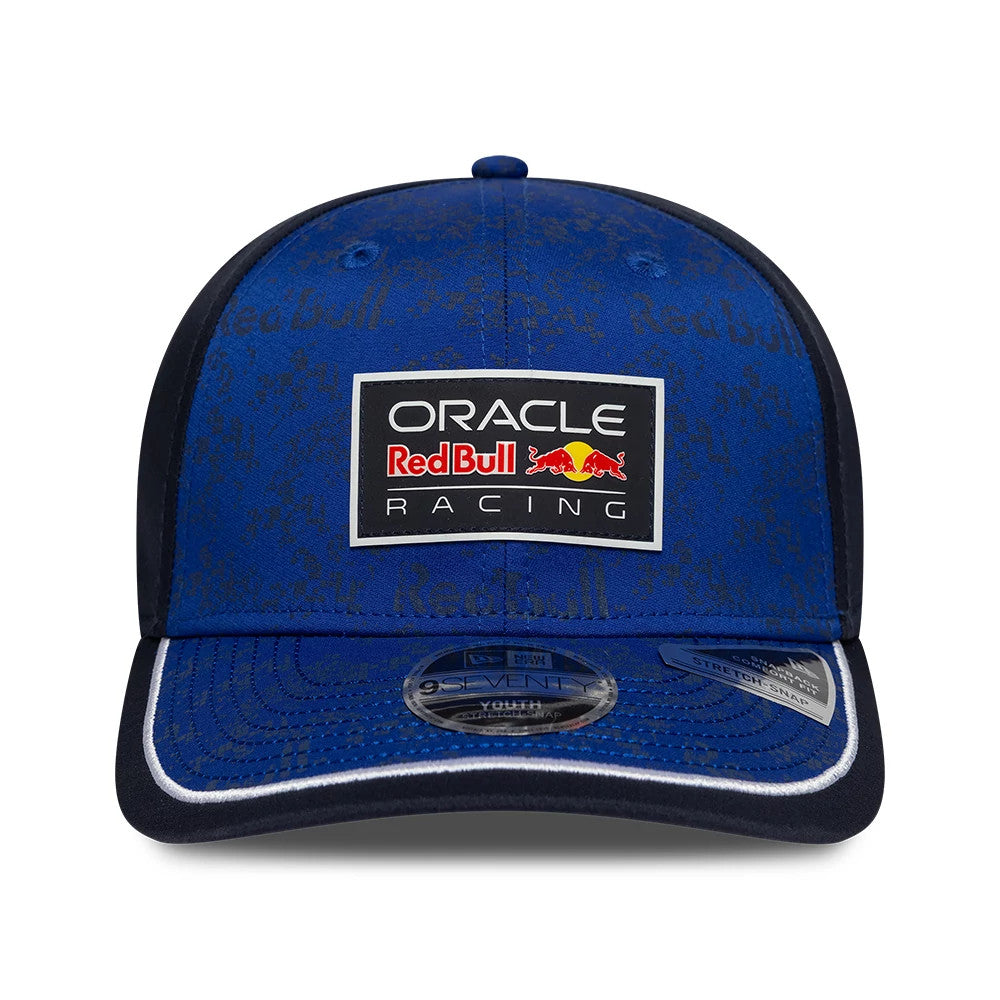 Red Bull Racing Youth Team Dark Blue New Era 9SEVENTY Stretch Snap Adjustable Cap, front view showing a raised embroidered Oracle Red Bull Racing patch on the centre front, with a 9SEVENTY size sticker on the dark blue curved visor.