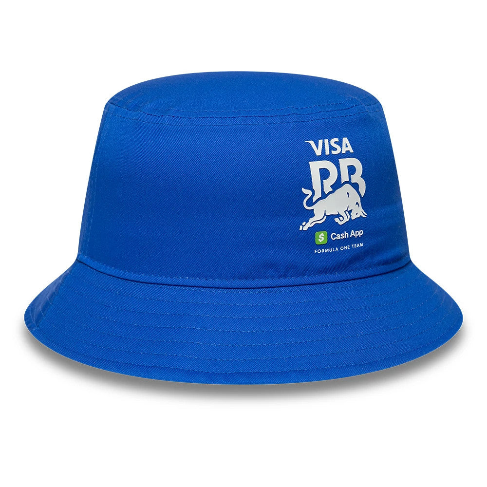 New Era Visa Cash App Racing Bulls Essential Bright Blue Bucket Hat, three-quarter view showing the white Visa logo with a charging bull graphic on the front panel above a Cash App Formula One Team logo, all set against a blue fabric.