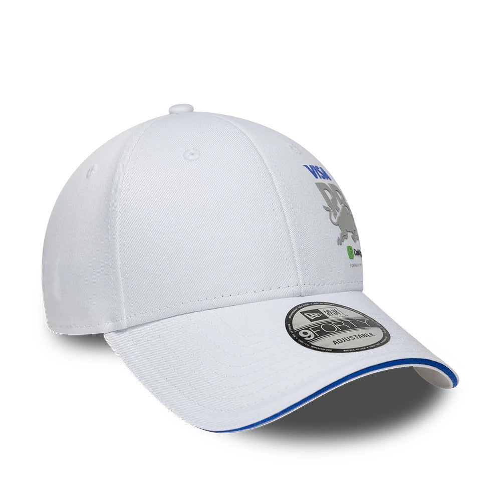 Visa Cash App Racing Bulls Essential White New Era 9FORTY Adjustable Cap, three-quarter view showing a grey and blue embroidered bull with a Visa logo on the front panel, curved white visor with blue trim, and 9FORTY size sticker.