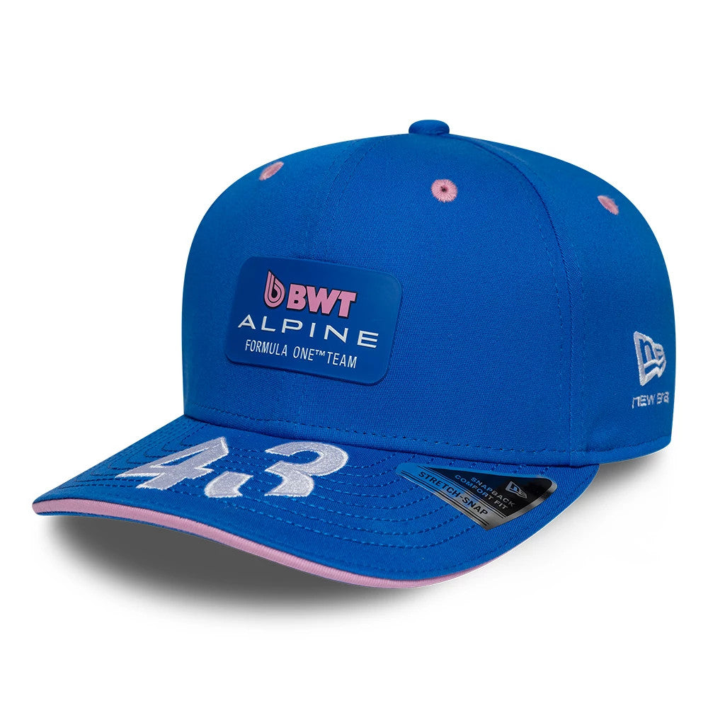 Alpine Racing Franco Colapinto Blue New Era 9SEVENTY Stretch Snap Adjustable Cap, front view showing raised white embroidered number 43 on the blue visor, pink undervisor, New Era flag logo on the left side.