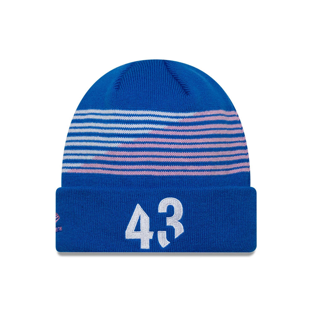 New Era Alpine Racing Blue Cuff Knit Beanie Hat, front view showing white number 43 embroidered on the front cuff, with a pattern of horizontal pink and white stripes around the crown above the cuff.