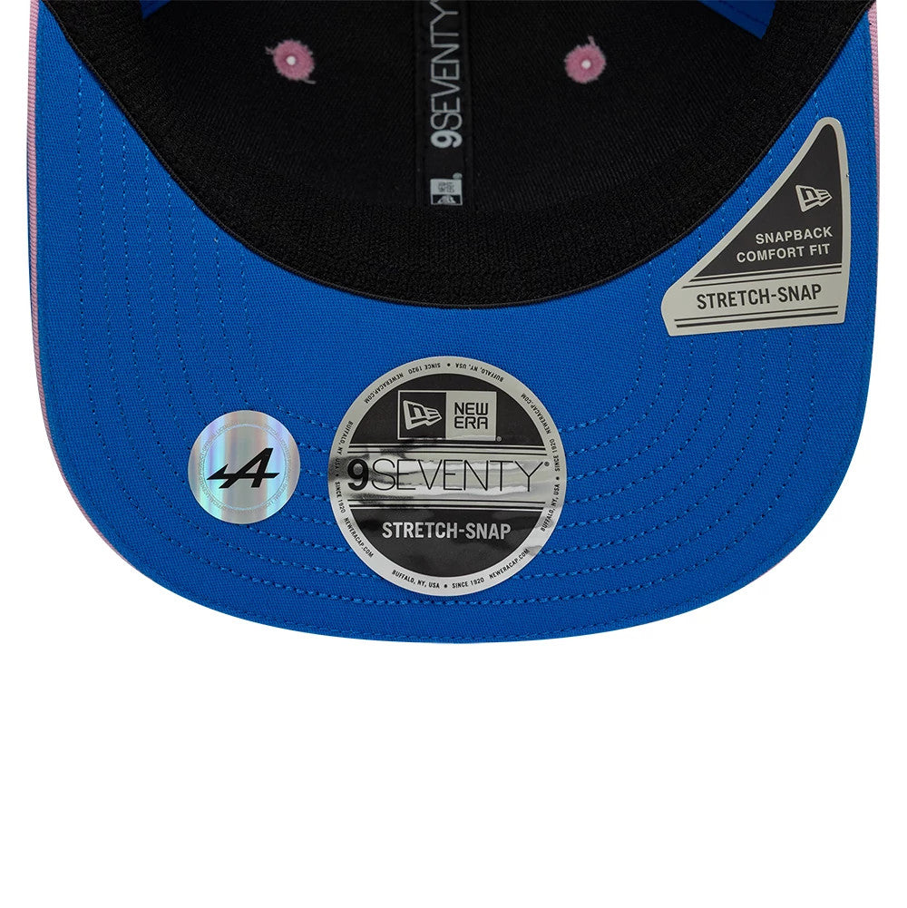 Alpine Racing Pierre Gasly Blue New Era 9SEVENTY Stretch Snap Adjustable Cap, inside view showing the black sweatband, black inner taping, blue undervisor, 9SEVENTY size sticker, and Alpine A logo sticker next to the visor.