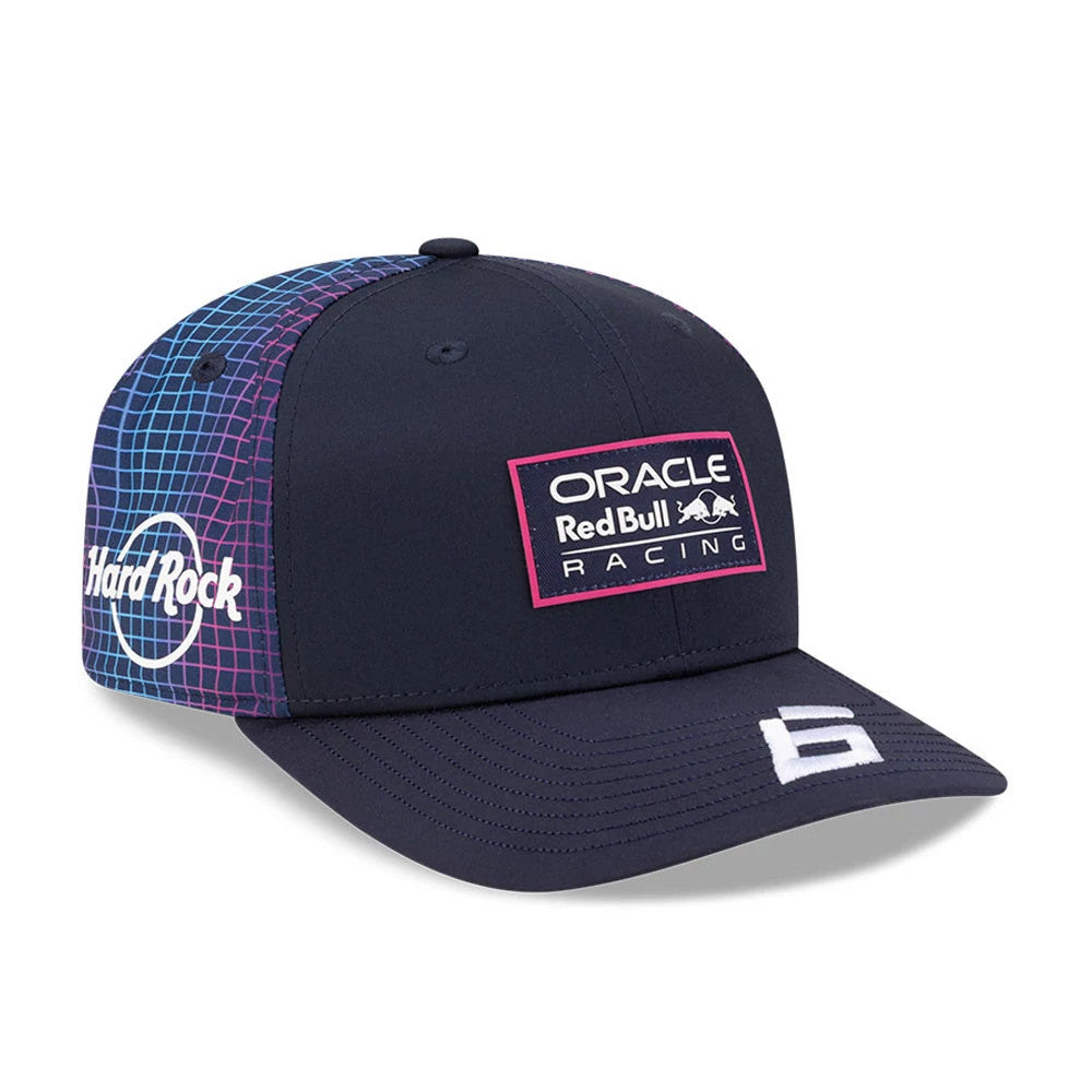 Red Bull Racing Miami Race Special Isack Hadjar Navy New Era 9SEVENTY Stretch Snap Adjustable Cap, three-quarter view showing the pink-edged patch with Oracle Red Bull Racing text on the front panel, and white Hard Rock logo on the right side.