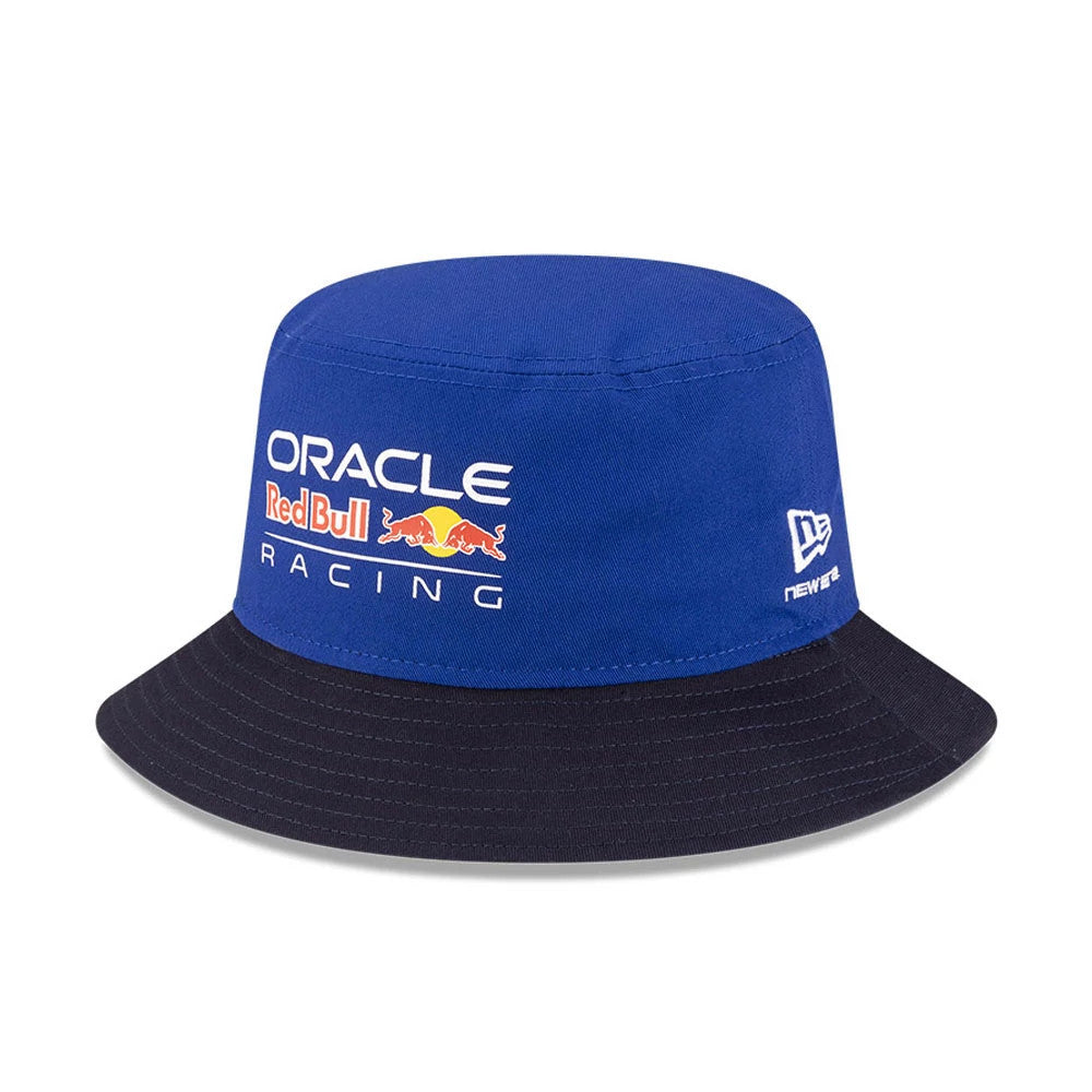 New Era Red Bull Racing Essential Dark Blue Bucket Hat, front view showing the Oracle Red Bull Racing logo with a red and yellow bull graphic on the structured dark blue crown and a contrasting black visor.