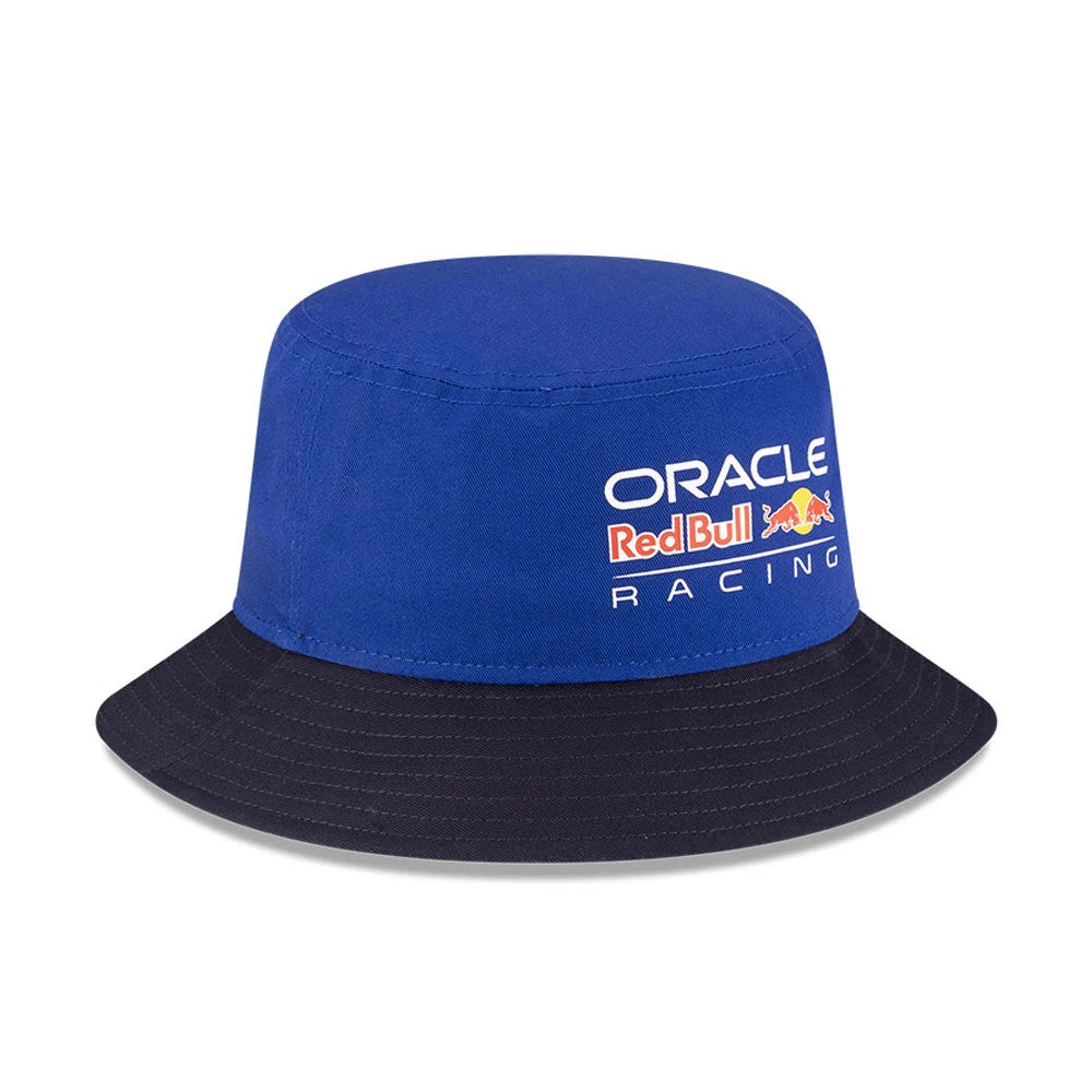 New Era Red Bull Racing Essential Dark Blue Bucket Hat, front view showing the white embroidered Oracle Red Bull Racing logo on the structured dark blue crown, paired with a contrasting black visor.