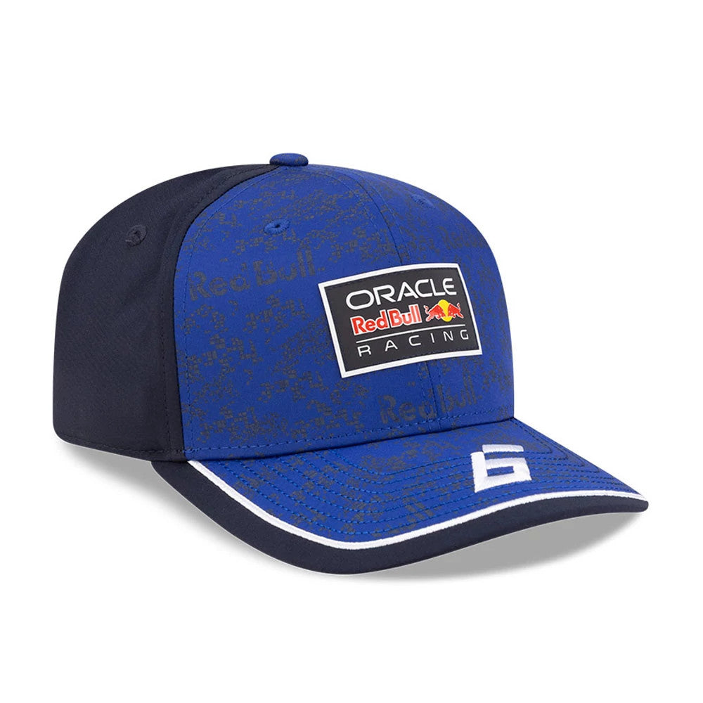 Red Bull Racing Isack Hadjar Dark Blue New Era 9SEVENTY Stretch Snap Adjustable Cap, front view showing a raised Red Bull Racing logo patch on the centre of the blue front panel, with a dark blue visor featuring a white embroidered number 6.