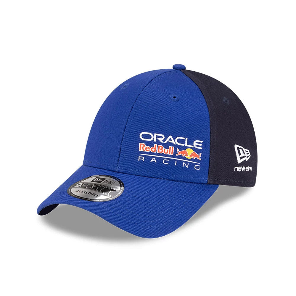 Red Bull Racing Essential Dark Blue New Era 9FORTY Adjustable Cap, three-quarter view showing the embroidered Oracle Red Bull Racing logo on the front panel, New Era flag logo on the left side, and 9FORTY size sticker on the curved visor.