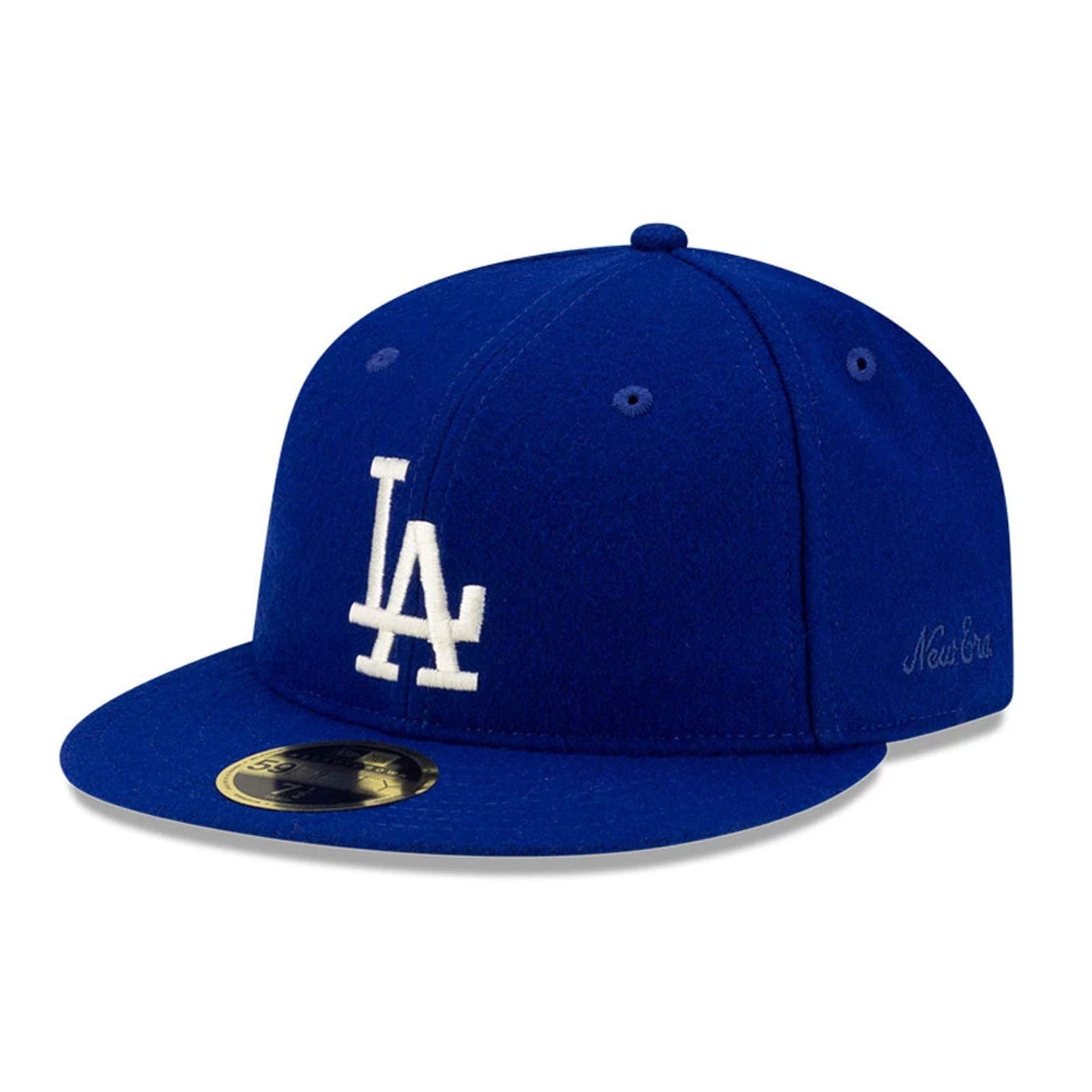 Pictured is this FOG X MLB LA Dodgers Retro Crown 59FIFTY Fitted cap in dark blue. 1