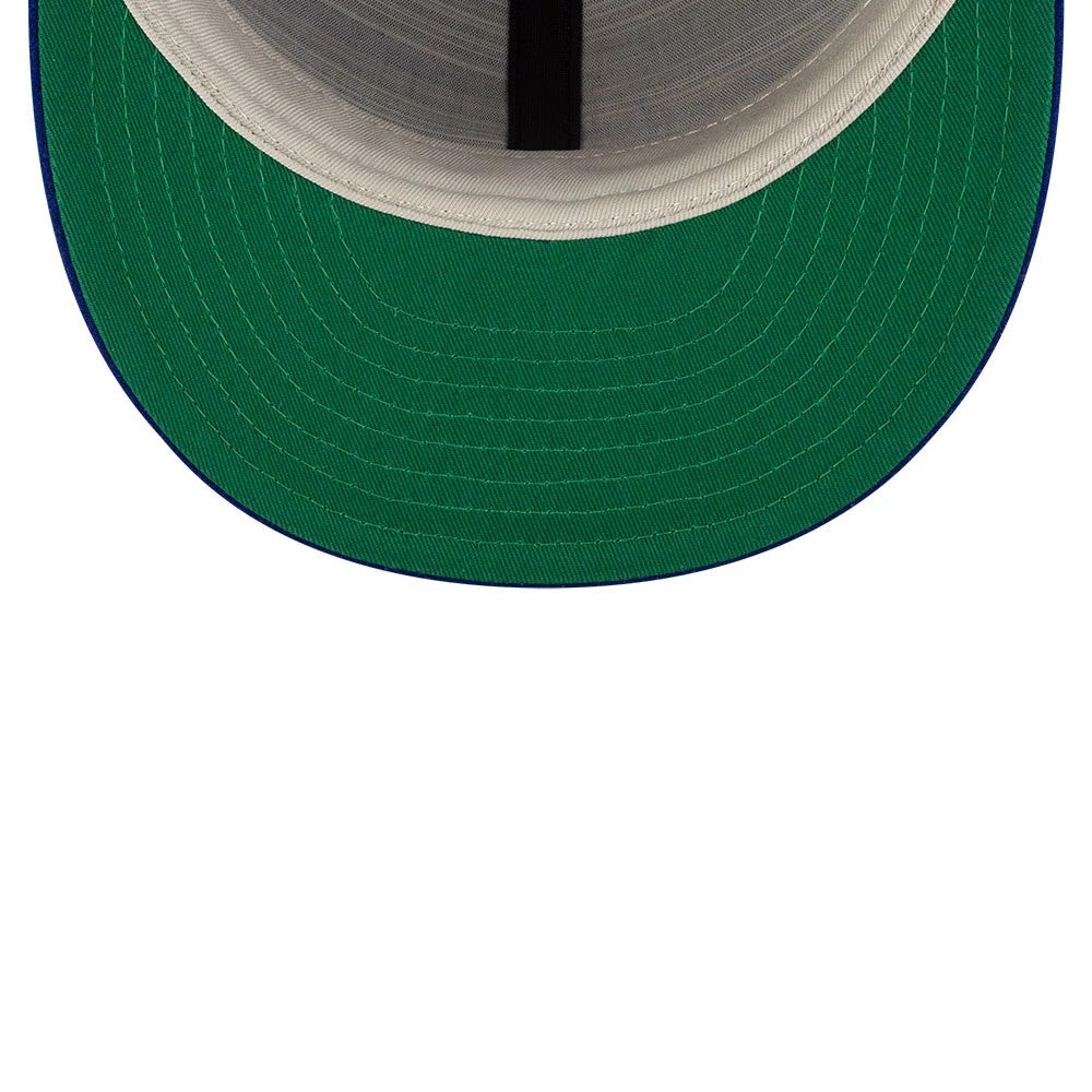 LA Dodgers FOG X MLB Dark Blue Retro Crown New Era 59FIFTY Fitted Cap, inside view showing a dark green undervisor with white stitching and black taping along the panels, complementing the dark blue edge of the visor.