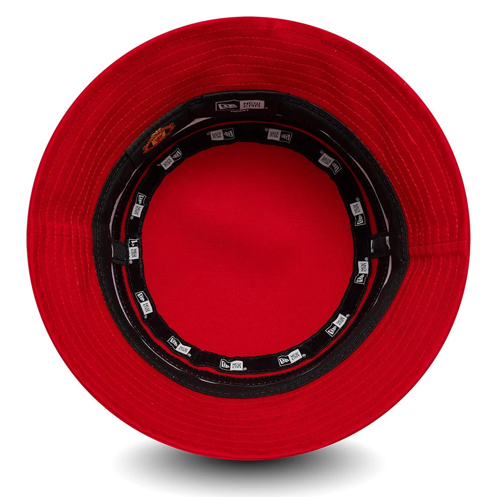 New Era Manchester United FC Infant Stripe Red Bucket Hat, inside view showing black sweatband with the New Era logo and Manchester United tag, and stitched red undervisor with taping around the crown.