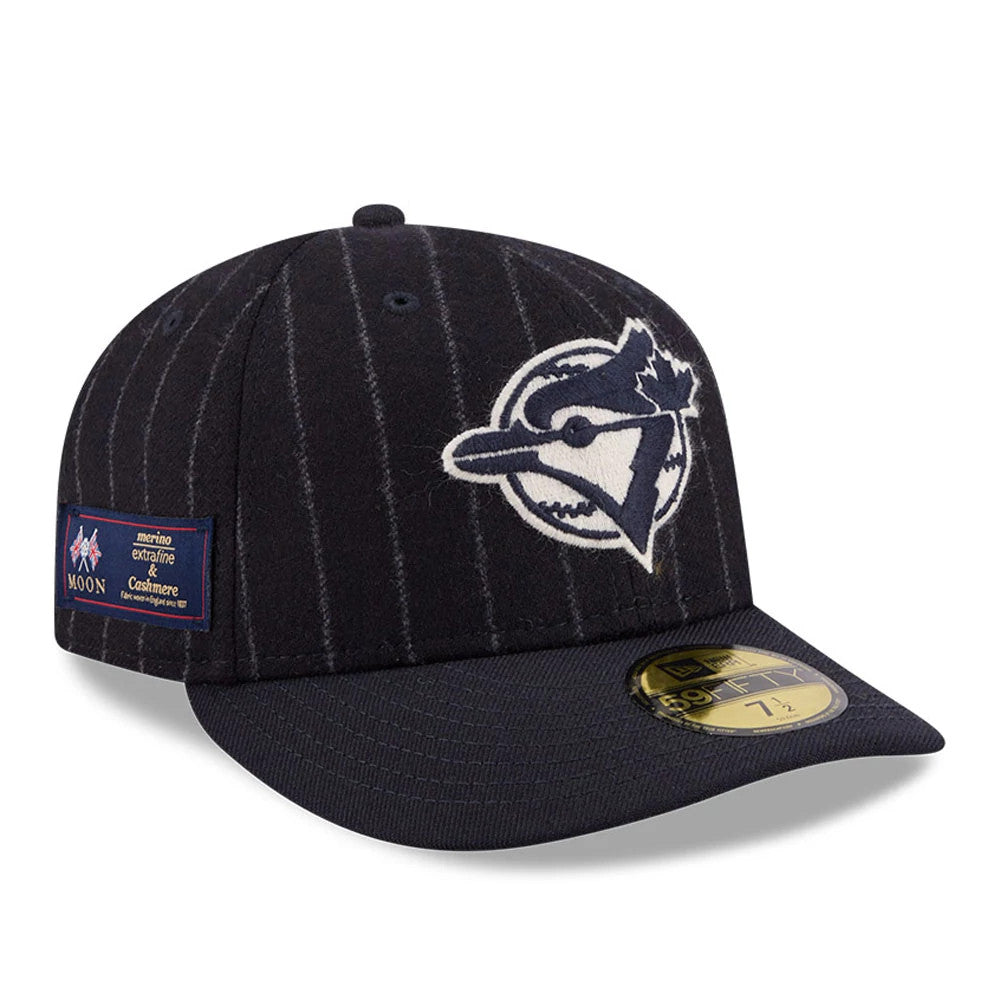 Toronto Blue Jays MLB X Moon Navy New Era 59FIFTY Fitted Cap, front view showing the large embroidered blue and white Blue Jays logo on the navy pinstriped crown, with a gold 59FIFTY size sticker on the flat visor and a side patch fabric features.