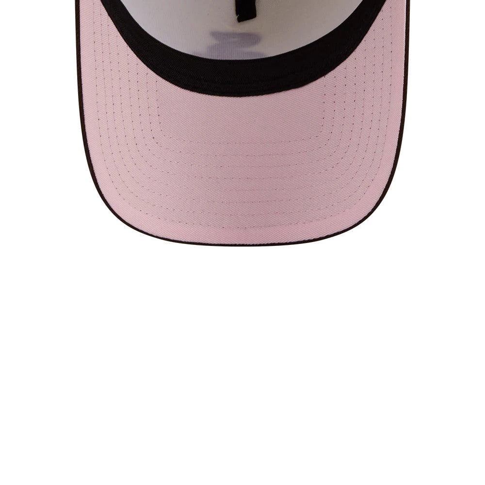 Chicago White Sox MLB City Script Cream New Era 9FORTY A-Frame Adjustable Cap, close-up of the interior featuring a pink undervisor and black sweatband contrasting the light crown, highlighting detailed stitching on the visor.