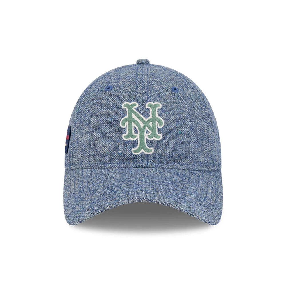 New York Mets MLB X Moon Blue New Era 9TWENTY Adjustable Cap, front view showing a white and green embroidered Mets logo on the front panel with blue eyelets and a slightly curved visor, and a small logo on the left side.