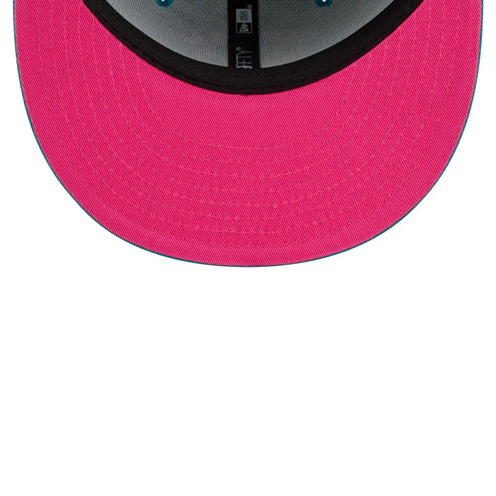 Netflix Squid Game Green New Era 59FIFTY Fitted Cap, inside view showing bright pink undervisor, black sweatband, and grey interior taping with New Era branding, highlighting a contrast between the pink and green elements.