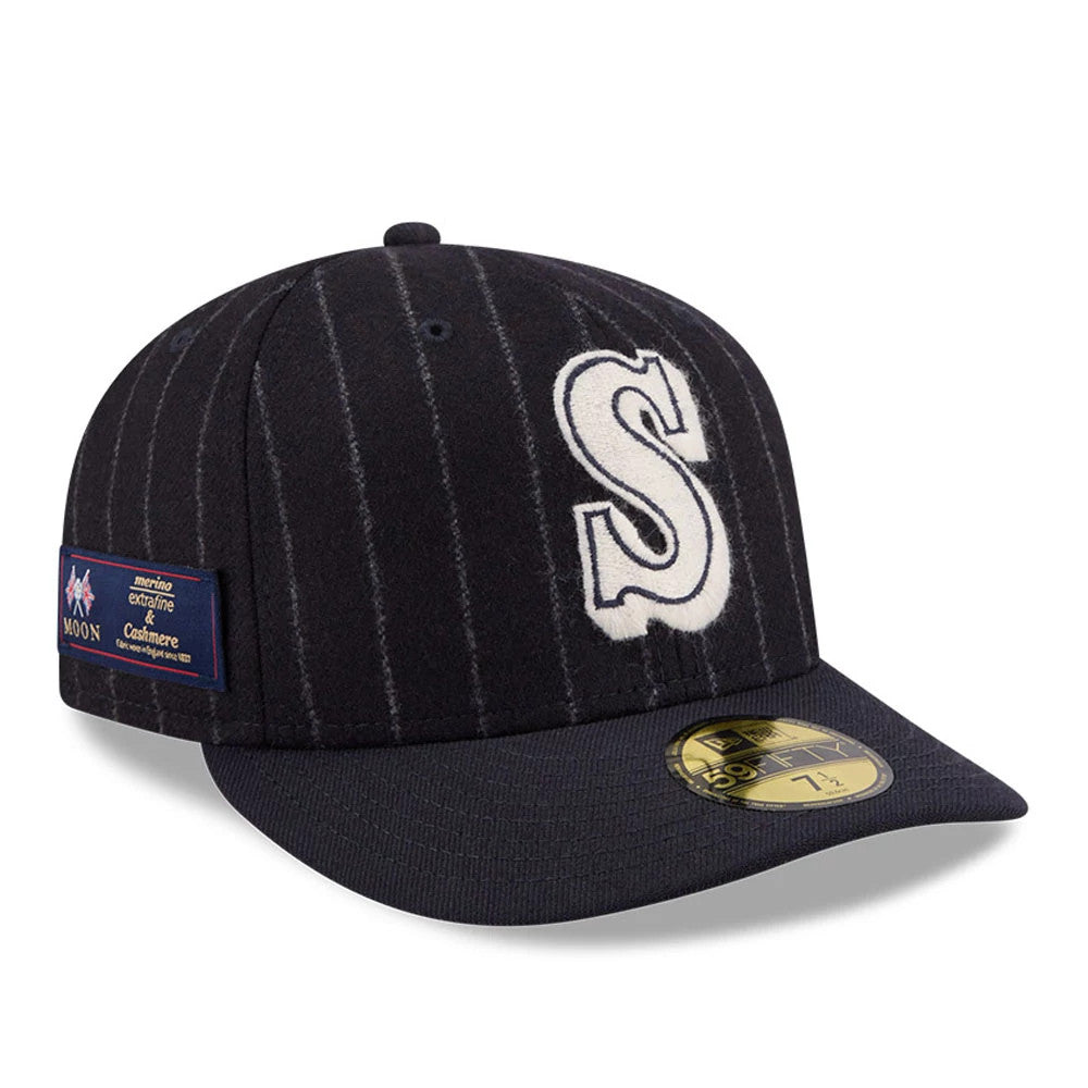 Seattle Mariners MLB X Moon Navy New Era 59FIFTY Fitted Cap, three-quarter view showing the raised white embroidered S logo on the front panel, vertical pinstripes, and a gold 59FIFTY size sticker on the flat navy visor.