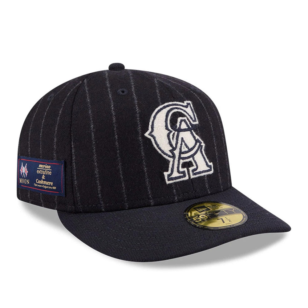 LA Angels MLB X Moon Navy New Era 59FIFTY Fitted Cap, three-quarter view showing white embroidered LA logo on the front panel, navy pinstripe pattern, gold 59FIFTY size sticker on the visor, and Moon patch on the left side.