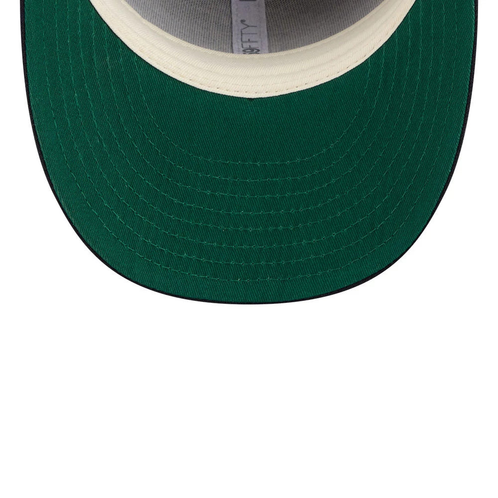 LA Angels MLB X Moon Navy New Era 59FIFTY Fitted Cap, inside view showing a green undervisor and cream sweatband, with 59FIFTY branding on the inner taping and detailed stitching on the visor.