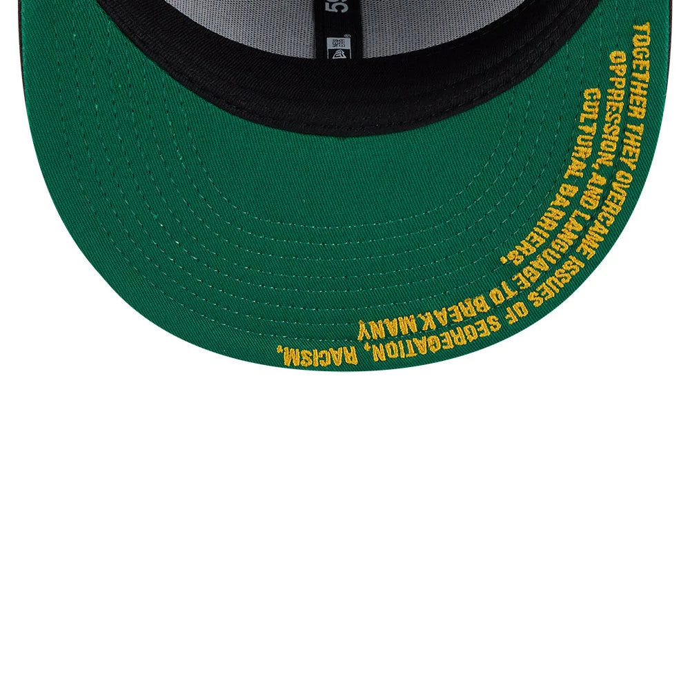 Homestead Grays MLB Negro League Dark Brown New Era 59FIFTY Fitted Cap, inside view showing a green undervisor with yellow text overcoming cultural barriers, black taping and a grey sweatband.