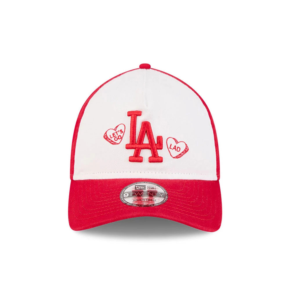 LA Dodgers MLB Conversation Hearts Red New Era 9TWENTY A-Frame Adjustable Cap, front view showing red LA logo and conversation heart graphics on a white crown, with a red visor and 9TWENTY size sticker.