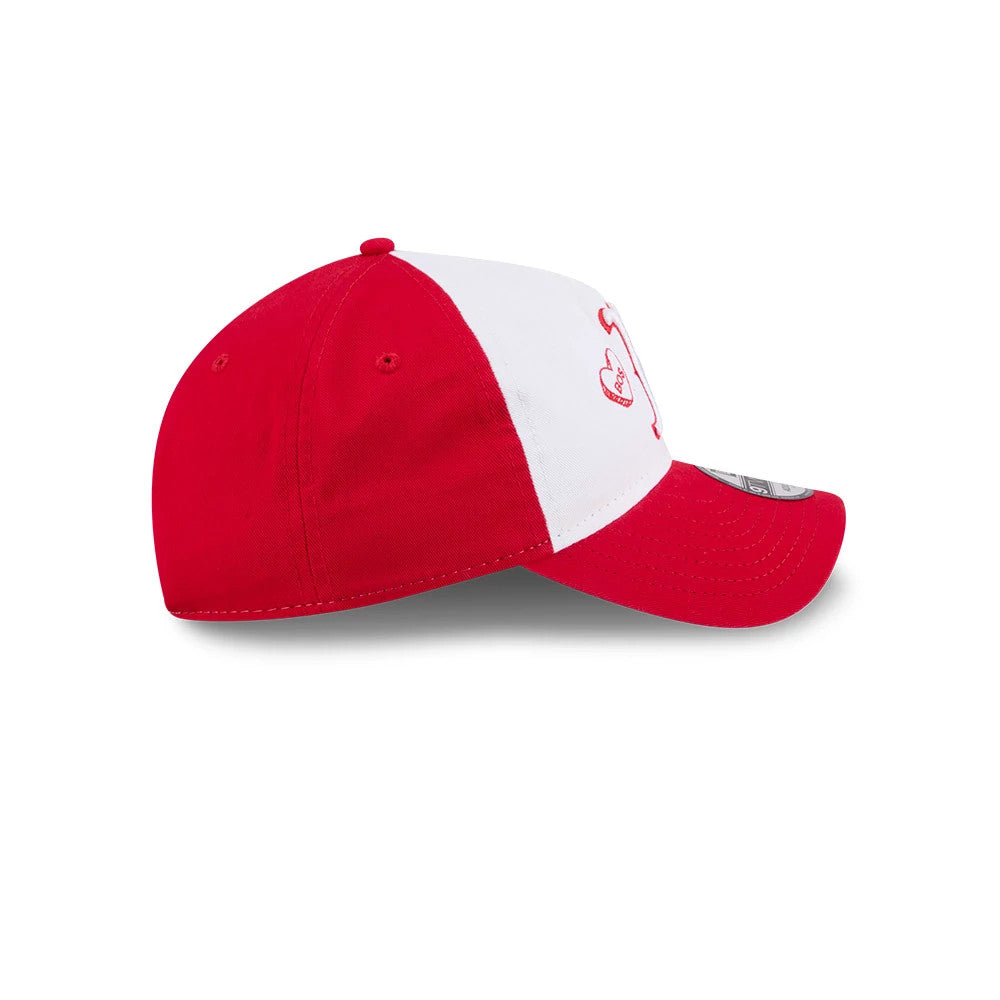 Boston Red Sox MLB Conversation Hearts Red New Era 9TWENTY A-Frame Adjustable Cap, side view showing the red heart logo with white embroidered details on the front panel and a curved red visor with a 9TWENTY size sticker on top.
