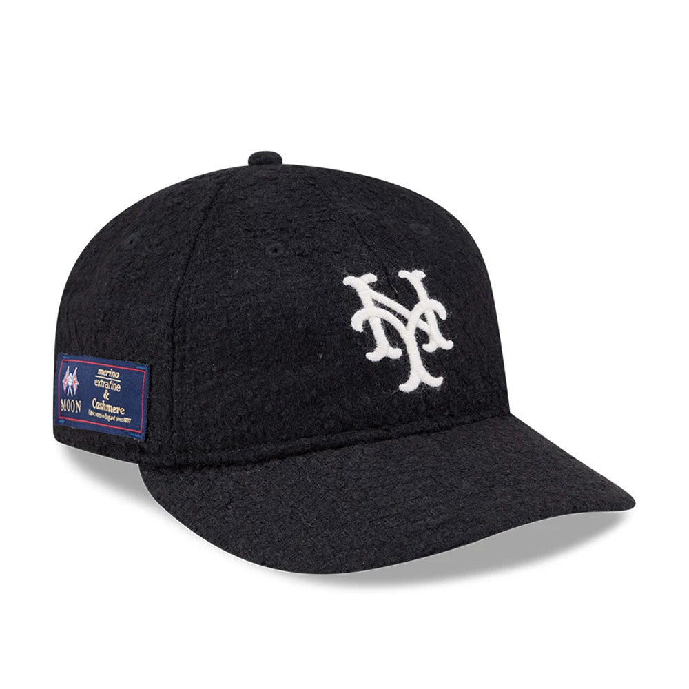 New York Mets MLB X Moon Navy Retro Crown New Era 9FIFTY Adjustable Cap, three-quarter view showing the white embroidered NY Mets logo on the front panel, with a fabric patch on the left side and a curved navy visor.
