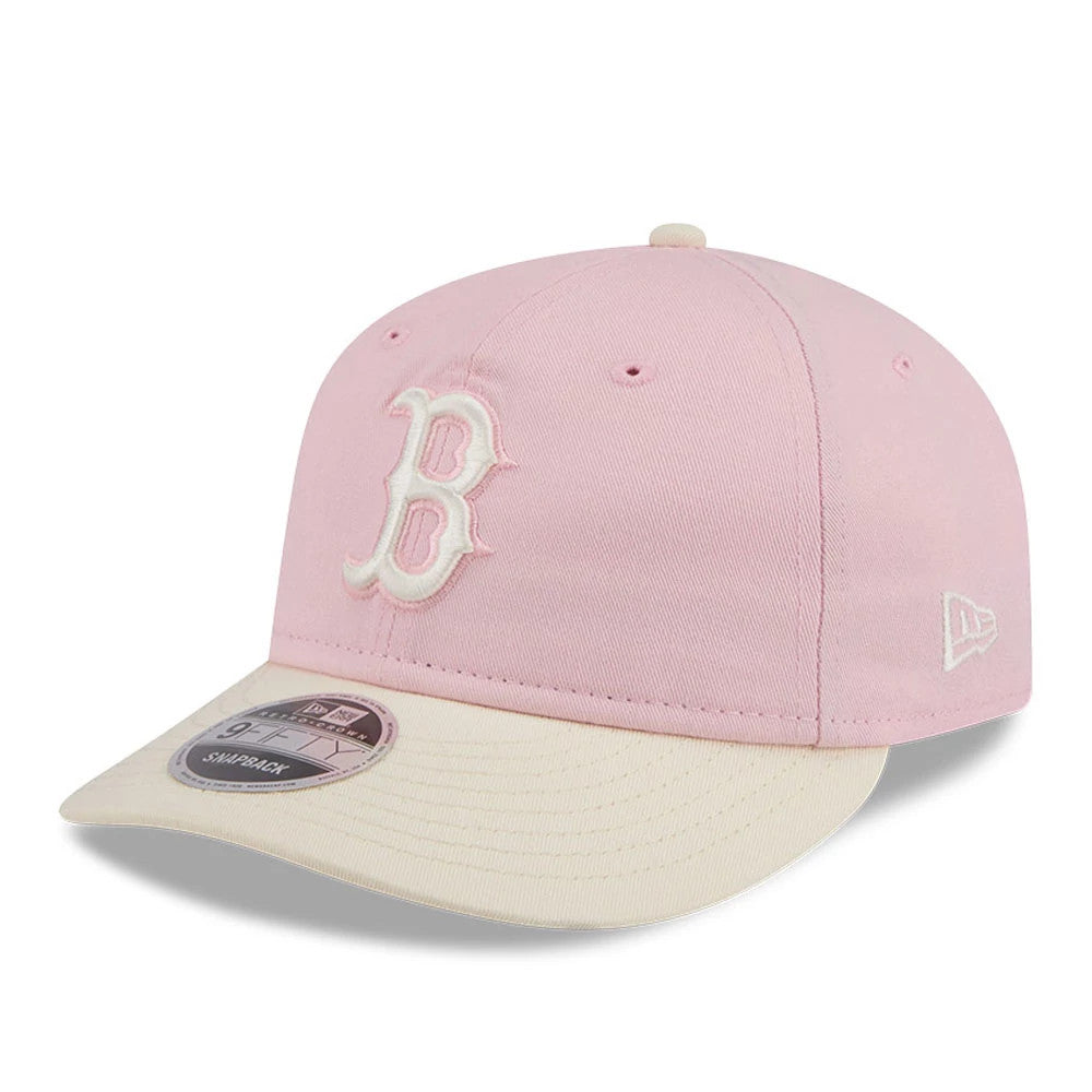Boston Red Sox MLB Washed Tie Dye Pastel Pink New Era 9FIFTY Snapback Adjustable Cap, front view showing the white embroidered B on the pink crown, cream flat visor with a 9FIFTY size sticker, and white New Era flag logo on the left side.