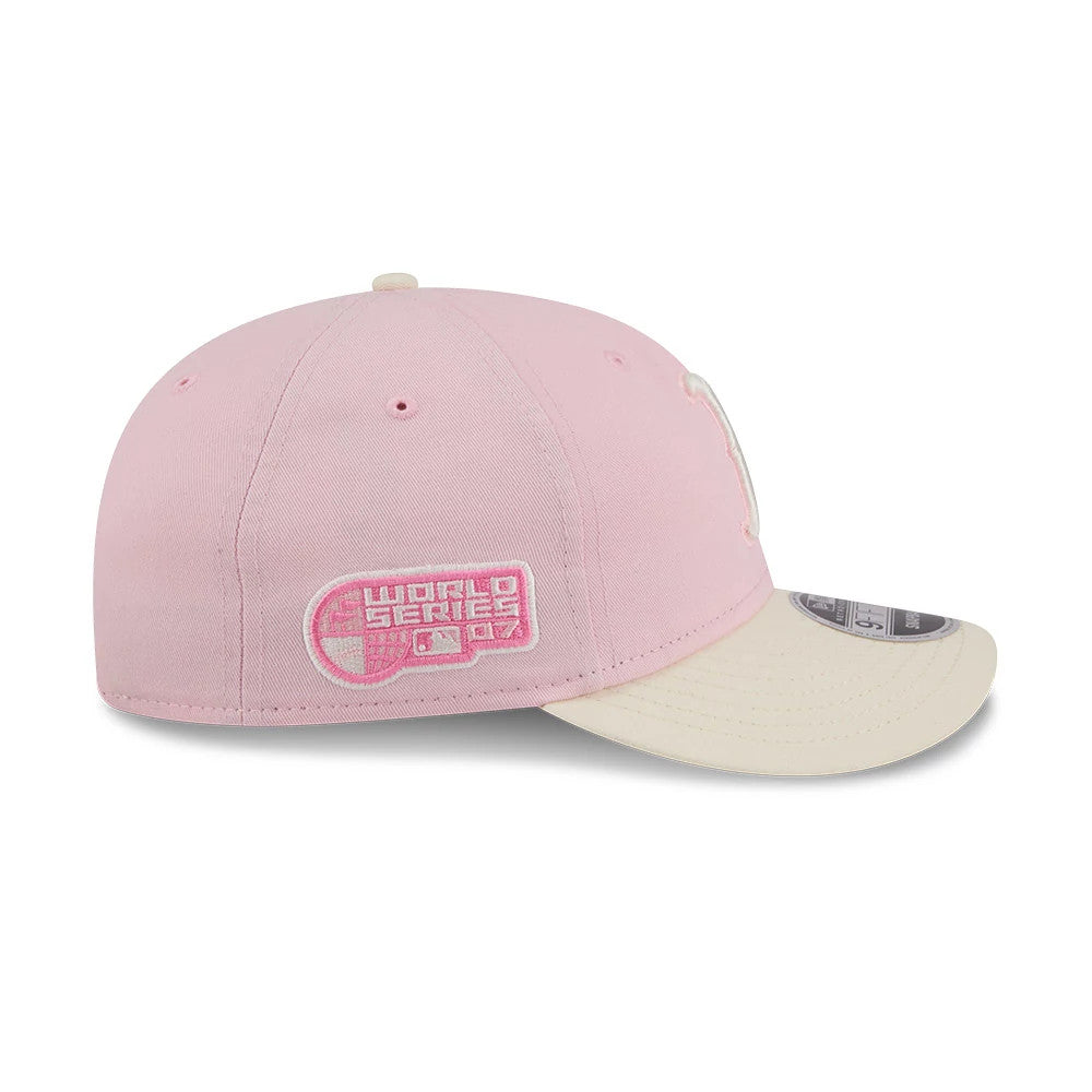 Boston Red Sox MLB Washed Tie Dye Pastel Pink New Era 9FIFTY Snapback Adjustable Cap, side view showing the pink embroidered World Series logo on the left panel, curved cream visor and a 9FIFTY size sticker.