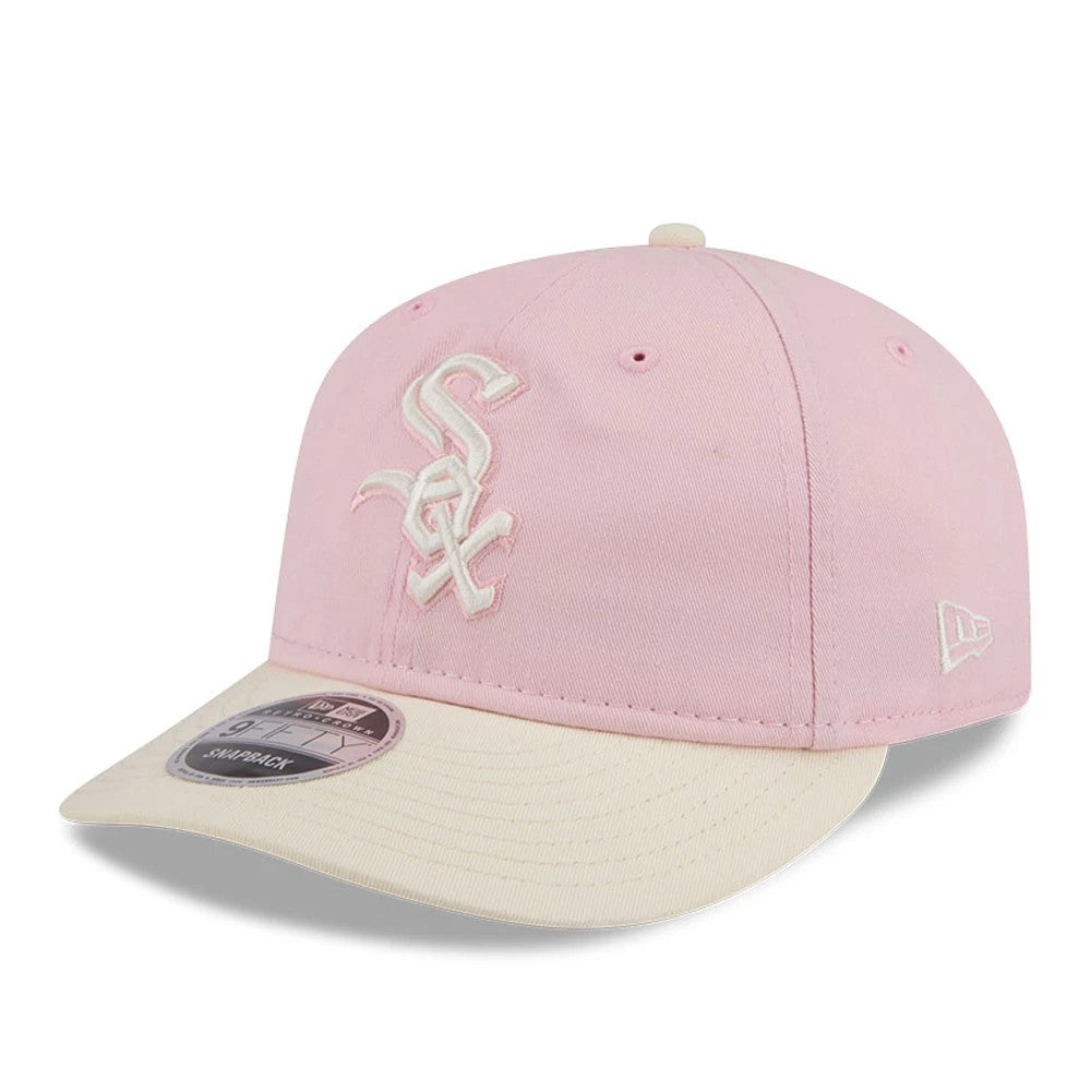 Chicago White Sox MLB Washed Tie Dye Pastel Pink New Era 9FIFTY Snapback Adjustable Cap, three-quarter view showing the cream embroidered Sox logo on the front panel, cream flat visor with a 9FIFTY size sticker.