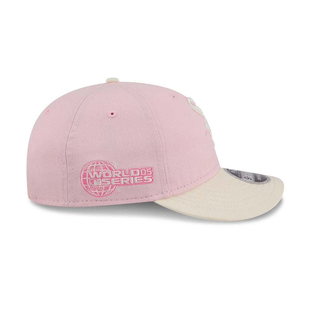 Chicago White Sox MLB Washed Tie Dye Pastel Pink New Era 9FIFTY Snapback Adjustable Cap, side view showing pink World Series embroidery on the back of the pink crown, with a beige curved visor and grey 9FIFTY size sticker on top.