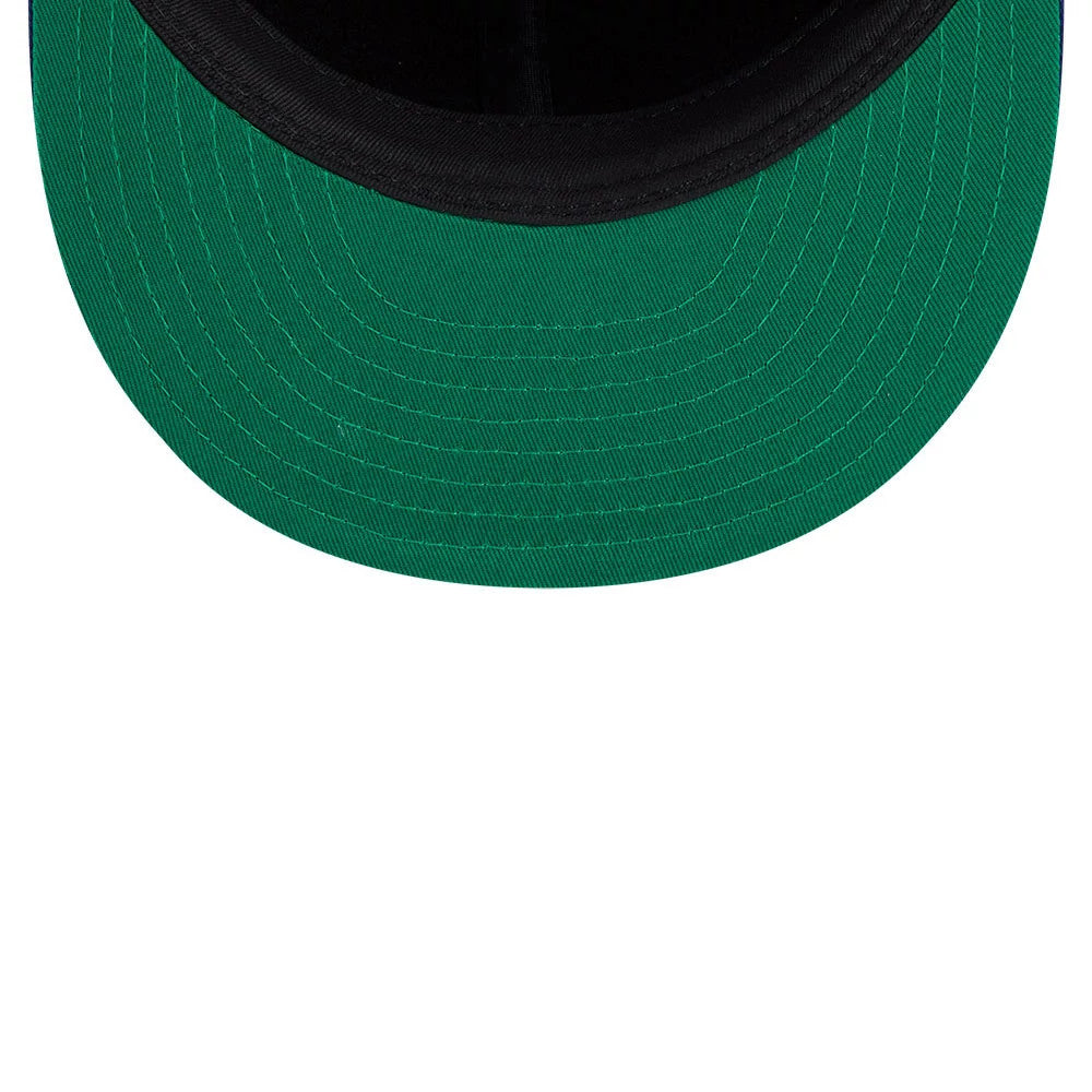 LA Dodgers MLB Felt Logo Dark Blue Retro Crown New Era 59FIFTY Fitted Cap, inside view showing the green undervisor and black sweatband, with stitching detail on the rim of the structured crown.