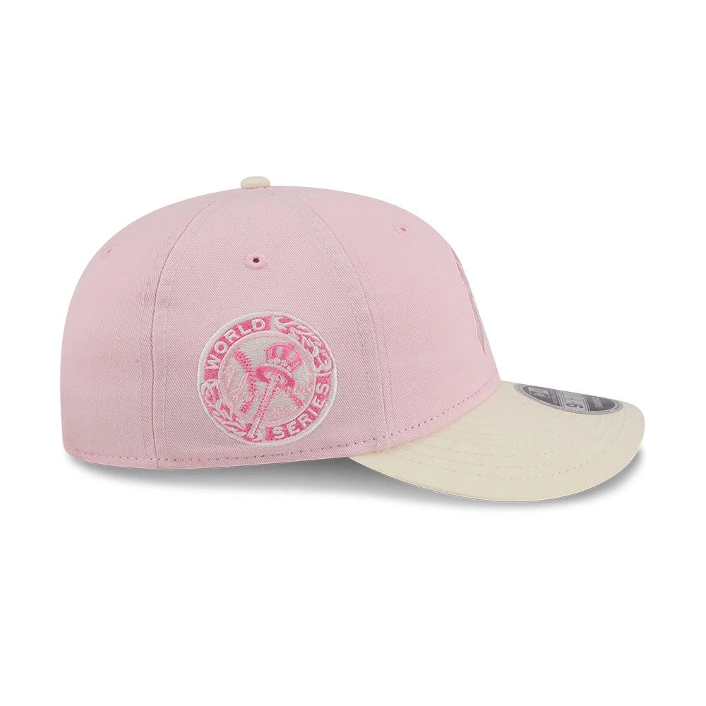 New York Yankees MLB Washed Tie Dye Pastel Pink New Era 9FIFTY Snapback Adjustable Cap, side view with a pink and white embroidered World Series patch on the left panel, cream flat visor, and 9FIFTY size sticker.