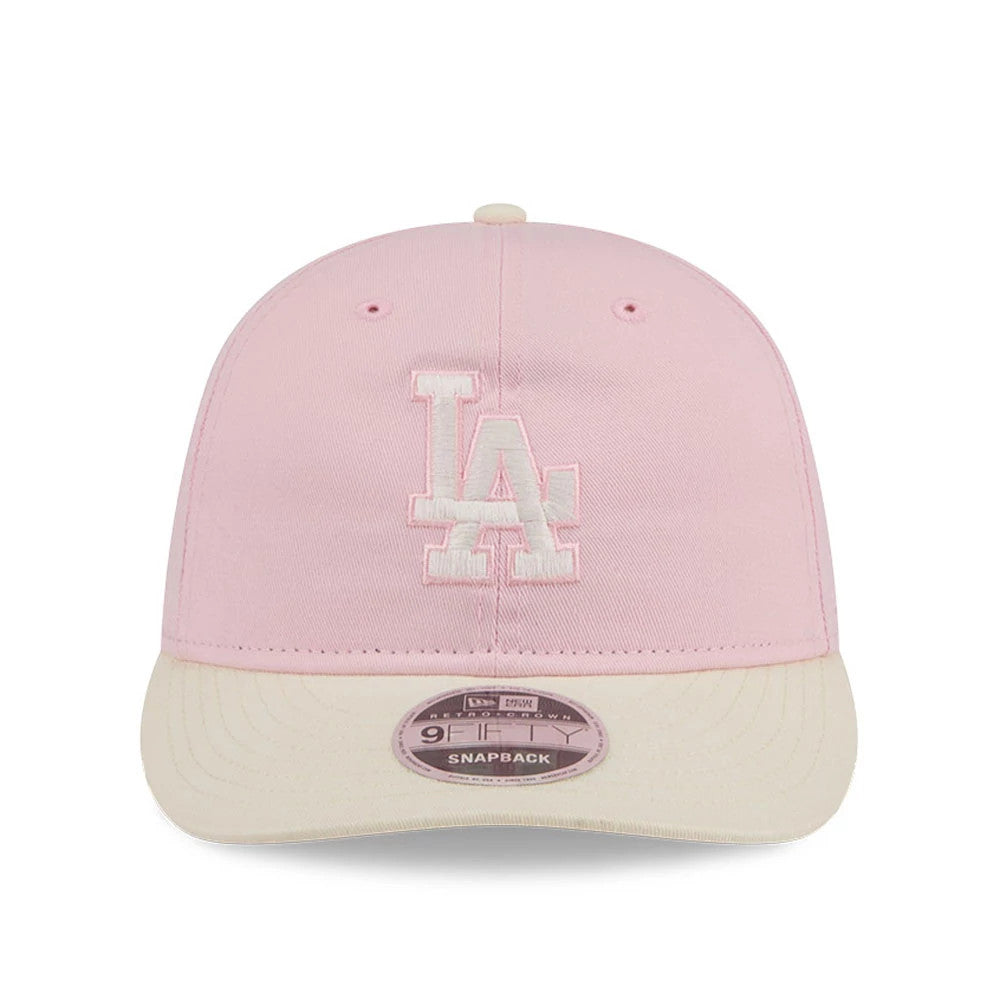 LA Dodgers MLB Washed Tie Dye Pastel Pink New Era 9FIFTY Snapback Adjustable Cap, front view showing the white raised embroidered LA logo on the pastel pink crown, cream flat visor, and a 9FIFTY size sticker on the visor.