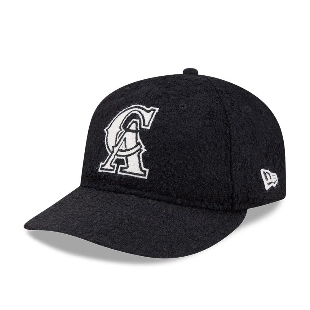 LA Angels MLB X Moon Navy Retro Crown New Era 9FIFTY Adjustable Cap, three-quarter view showing the white embroidered LA logo on the front panel, a matching dark navy visor, and the white New Era flag logo on the left side.