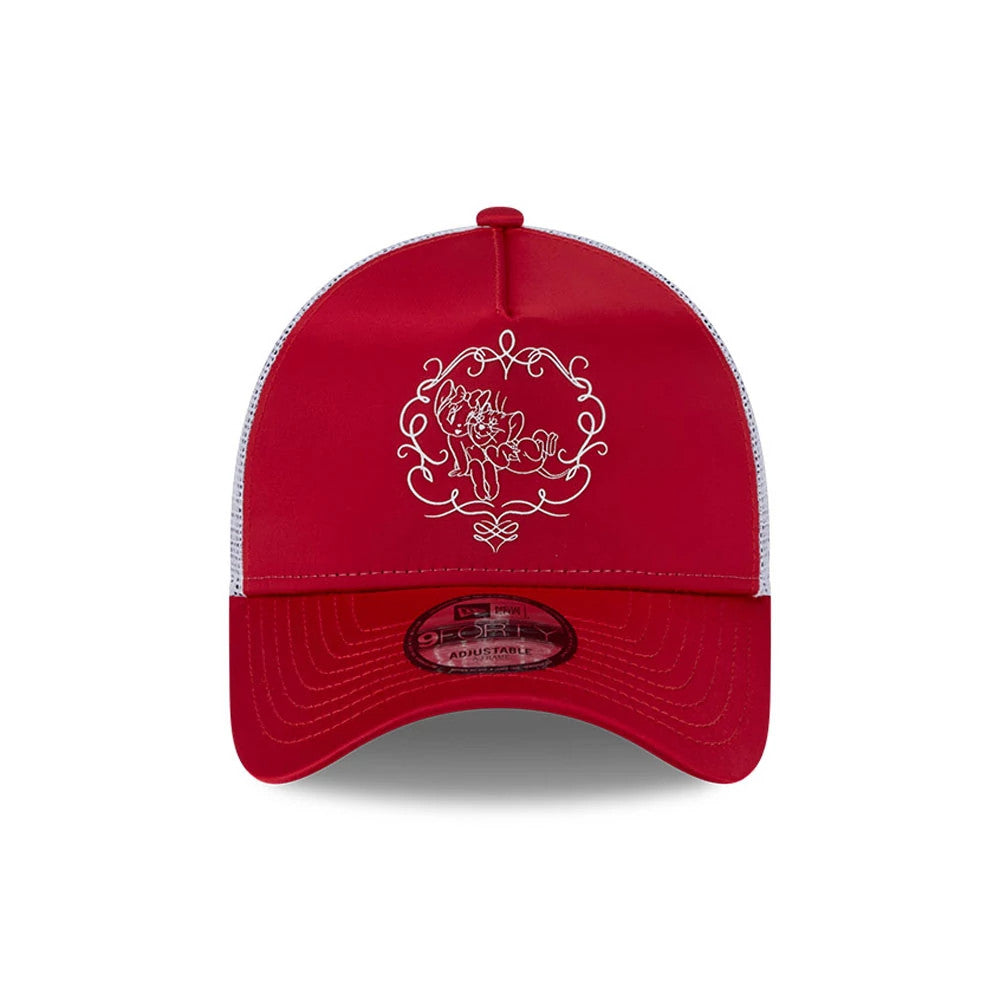 Tom & Jerry Love Cherie Red New Era 9FORTY A-Frame Trucker Adjustable Cap, front view showing a white embroidered design featuring Tom and Jerry framed by decorative swirls on the structured red crown, with a matching red curved visor.